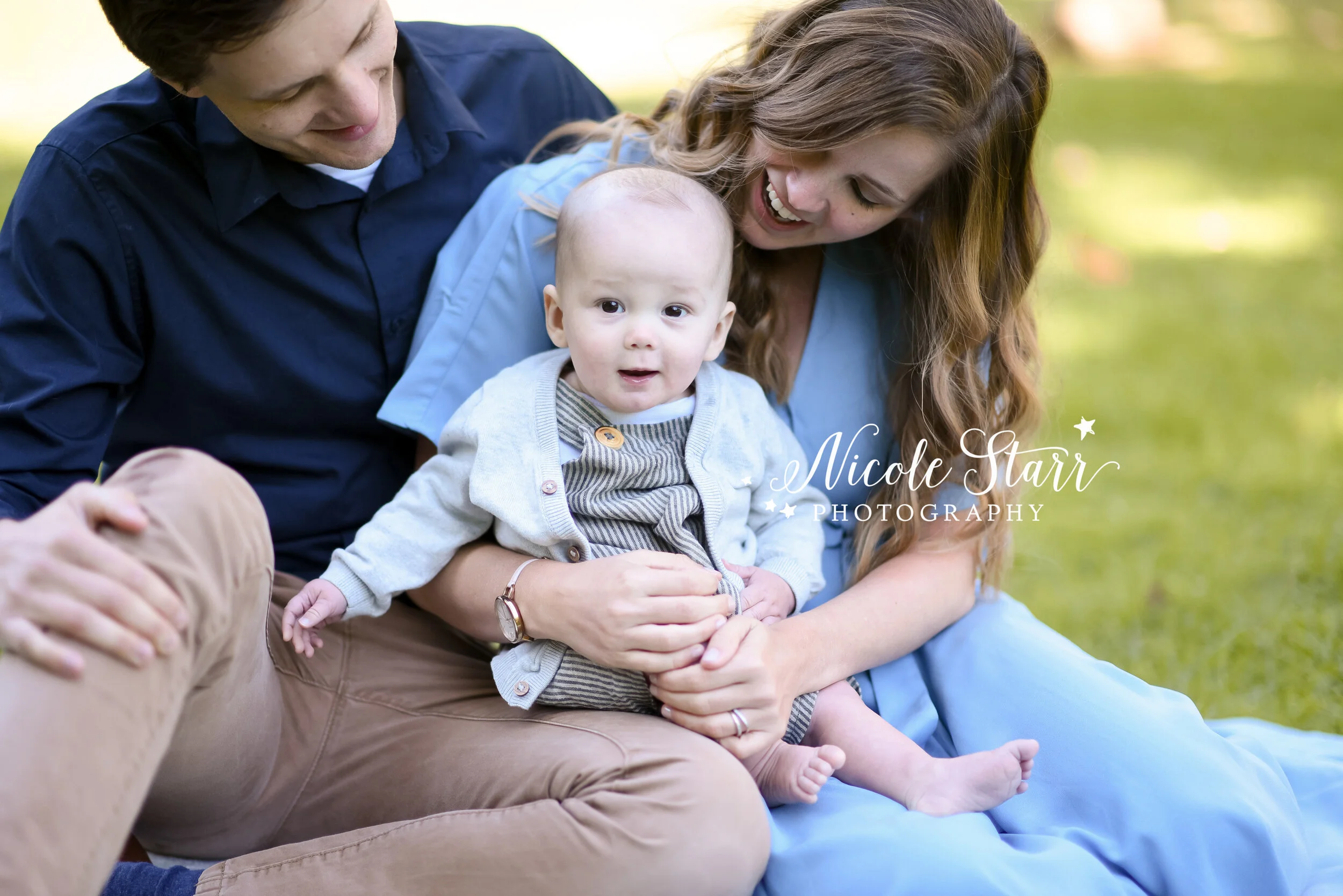parents hold son during NY family portraits with Saratoga Springs and Delmar NY family photographer Nicole Starr Photography