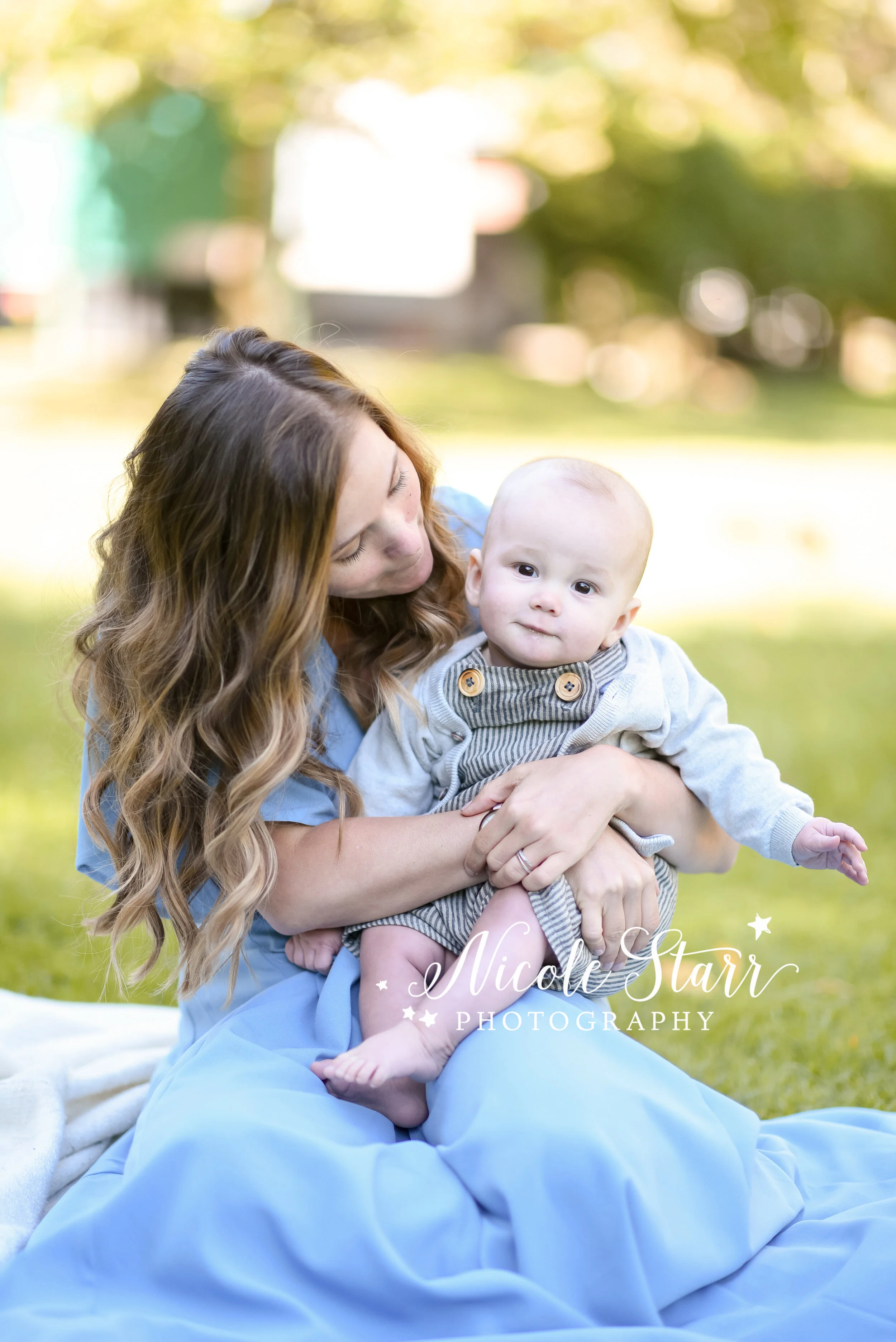 mom and son pose during fall family photos at Congress Park with Saratoga Springs and Delmar NY family photographer Nicole Starr Photography