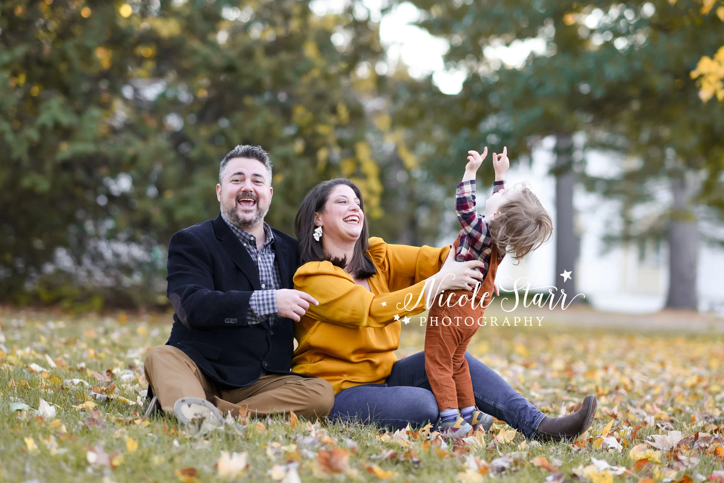 playful fall family photos in the leaves with Delmar NY family photographer Nicole Starr Photography