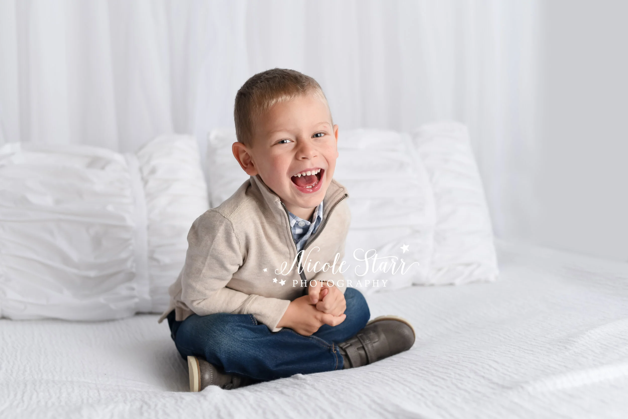 toddler laughs during family photos photographed by New York family and baby photographer Nicole Starr Photography