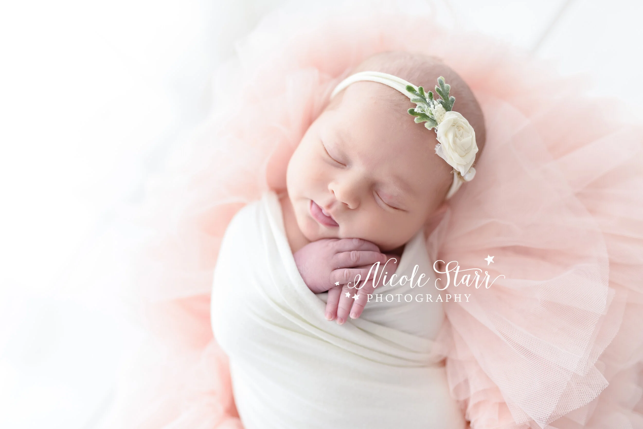 baby sleeps on blush pink setup with Saratoga Springs NY newborn photographer Nicole Starr Photography