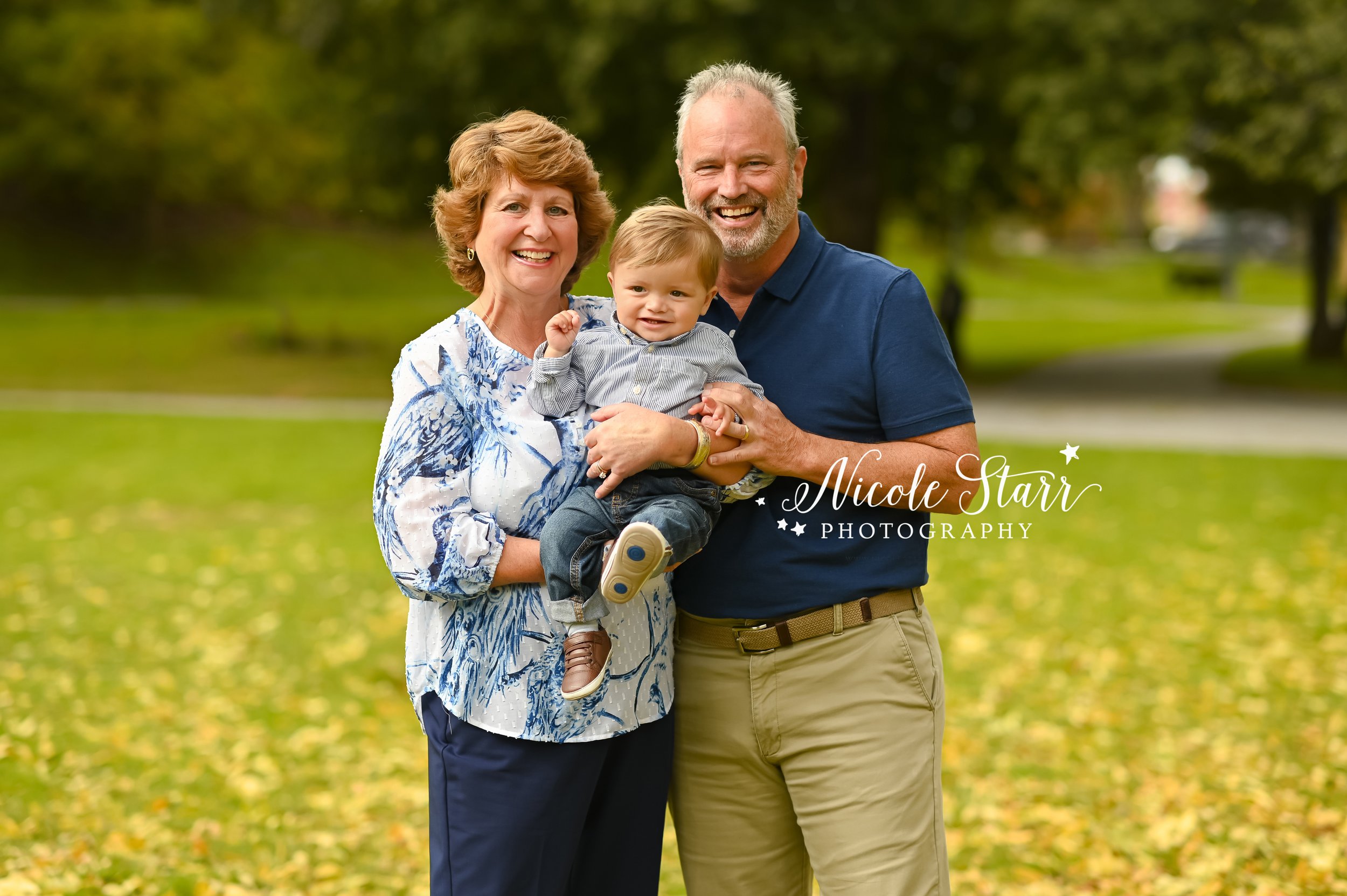 grandparents hug toddler during portraits with Saratoga Springs family photographer Nicole Starr Photography