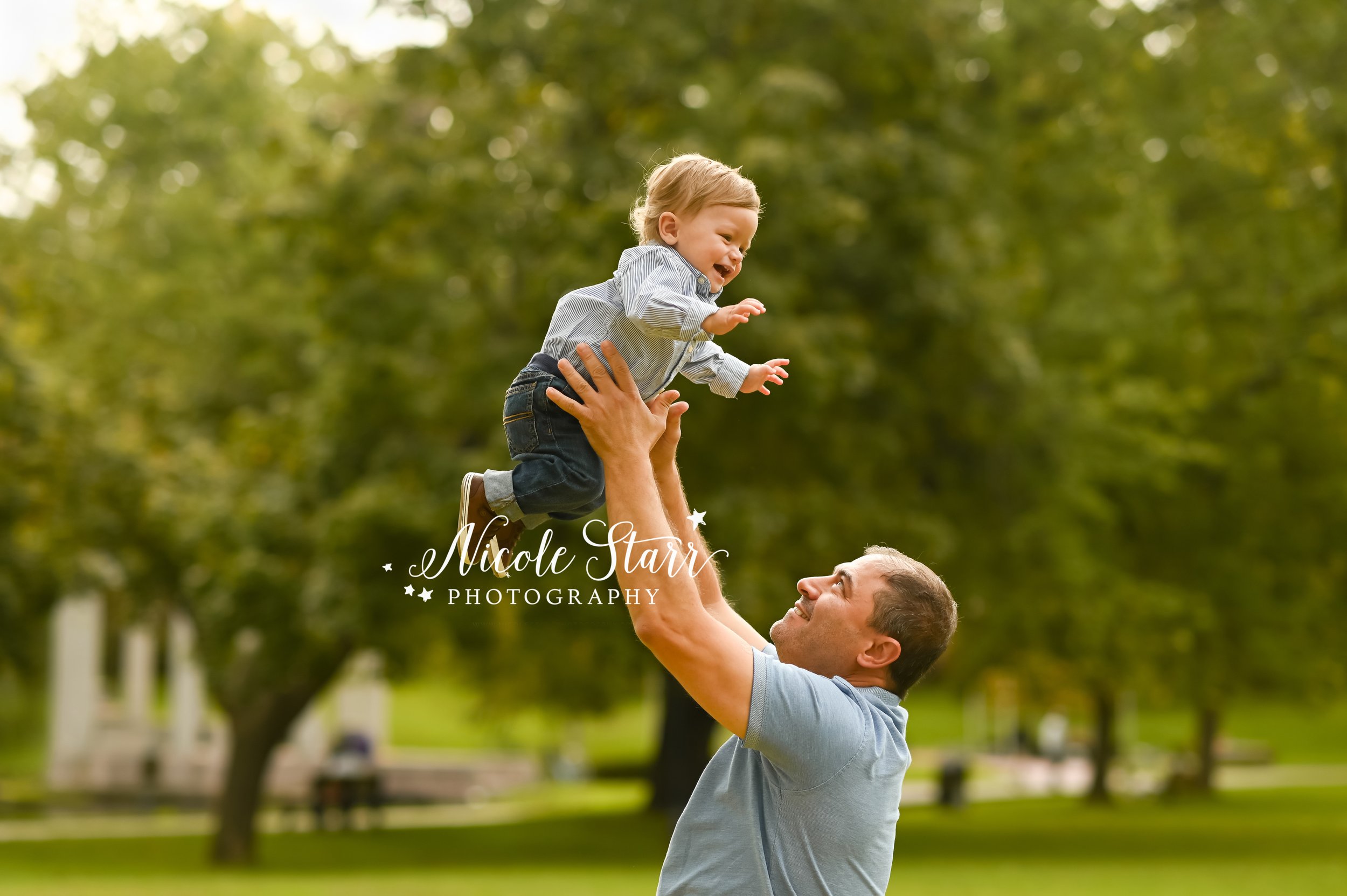 dad tosses son in air playfully with Saratoga Springs family photographer Nicole Starr Photography