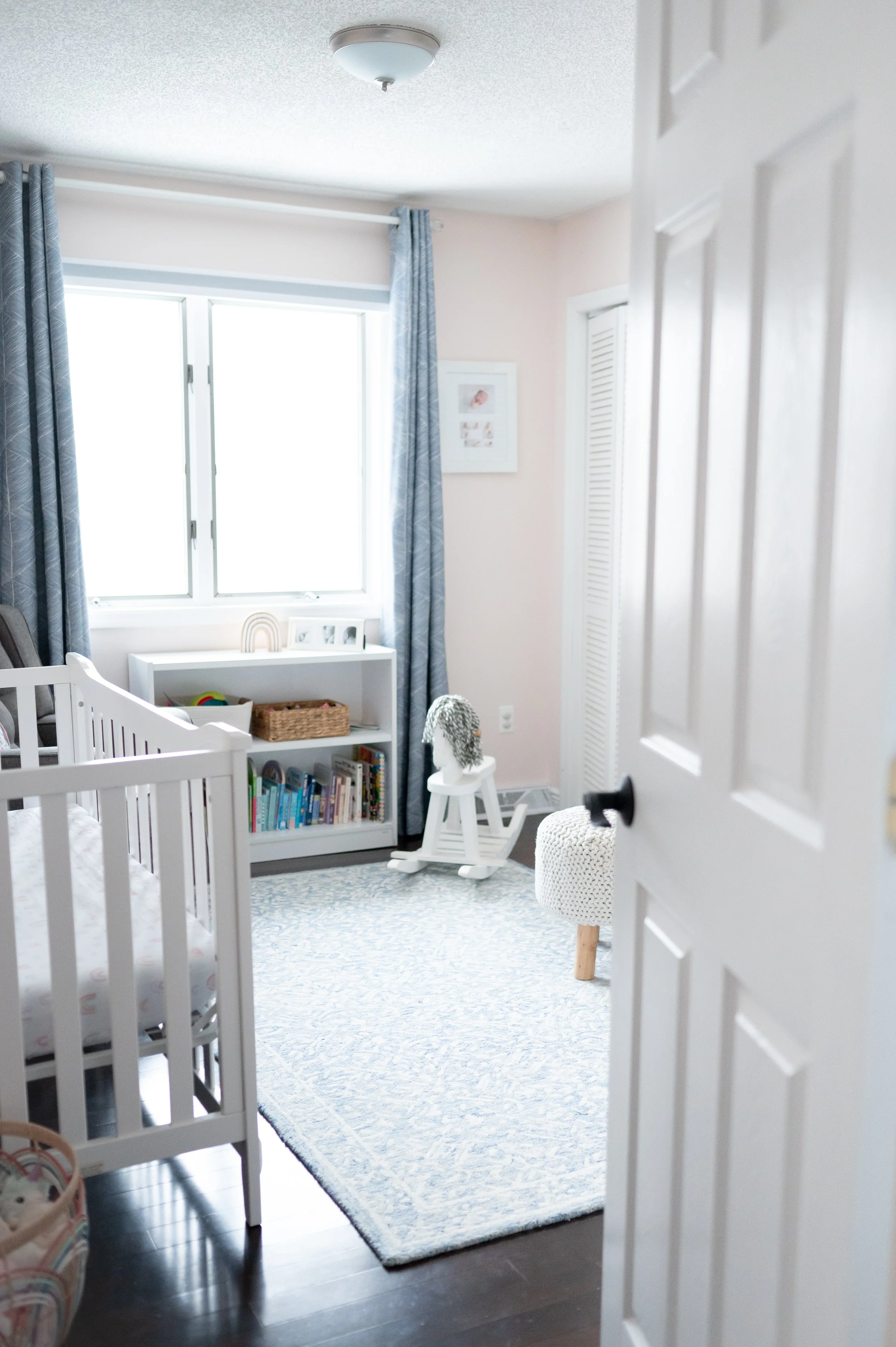 Baby girl nursery with Sherwin Williams Intimate White | blush and blue nursery | Saratoga Springs newborn photographer Nicole Starr Photography
