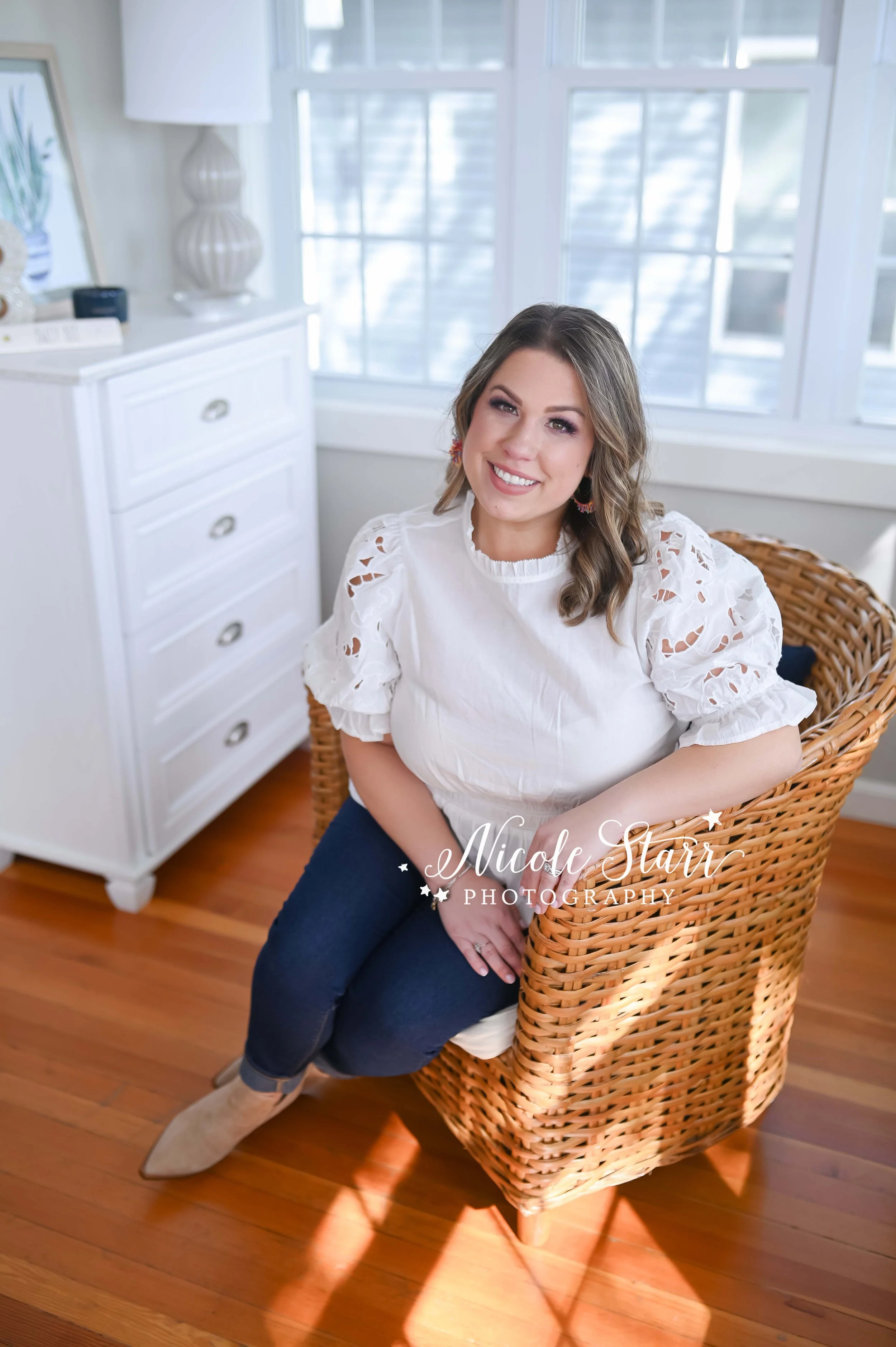woman sits in wicker chair with lace top photographed by Saratoga Springs NY headshot photographer Nicole Starr Photography