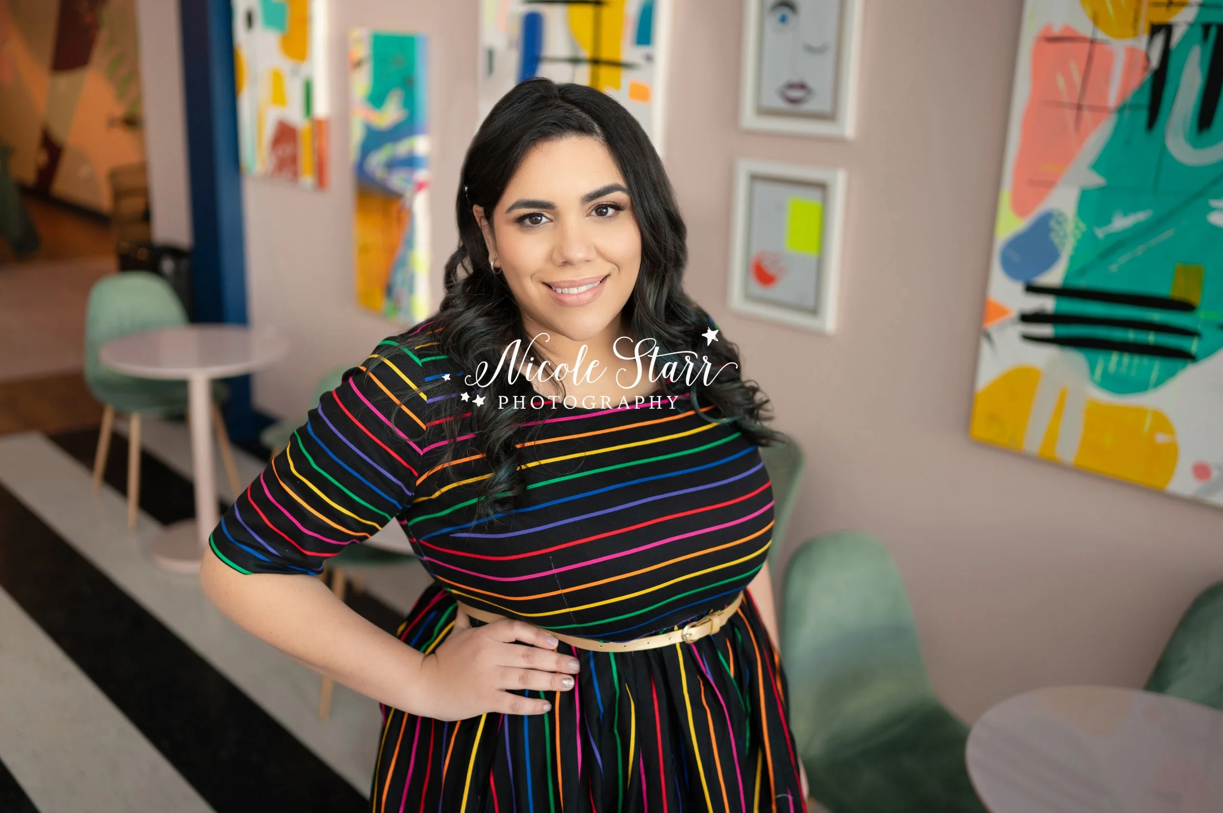 woman poses in rainbow dress during branding photos with Nicole Starr Photography