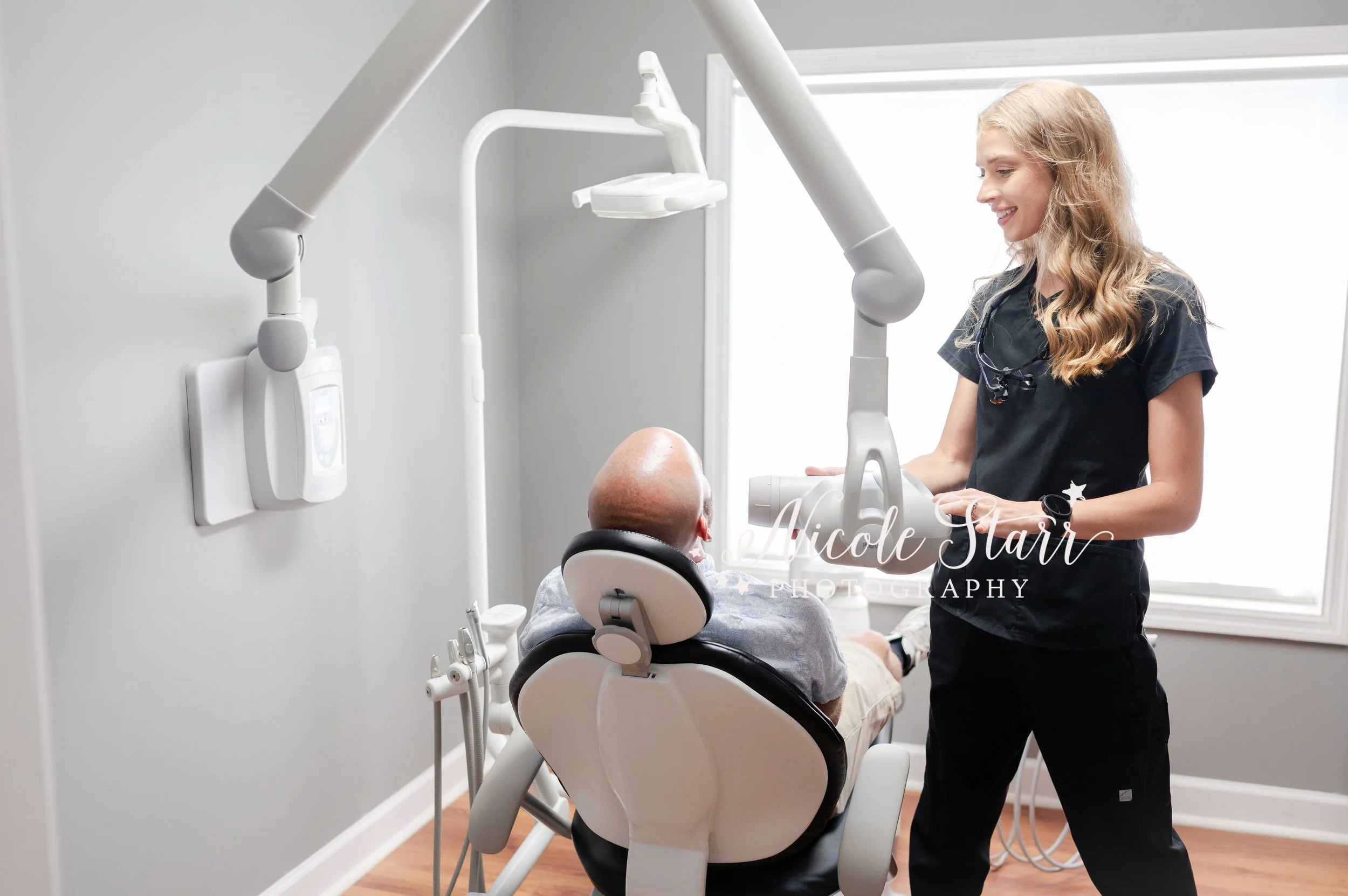 woman works in dental office during branding portraits with Saratoga Springs branding photographer Nicole Starr Photography