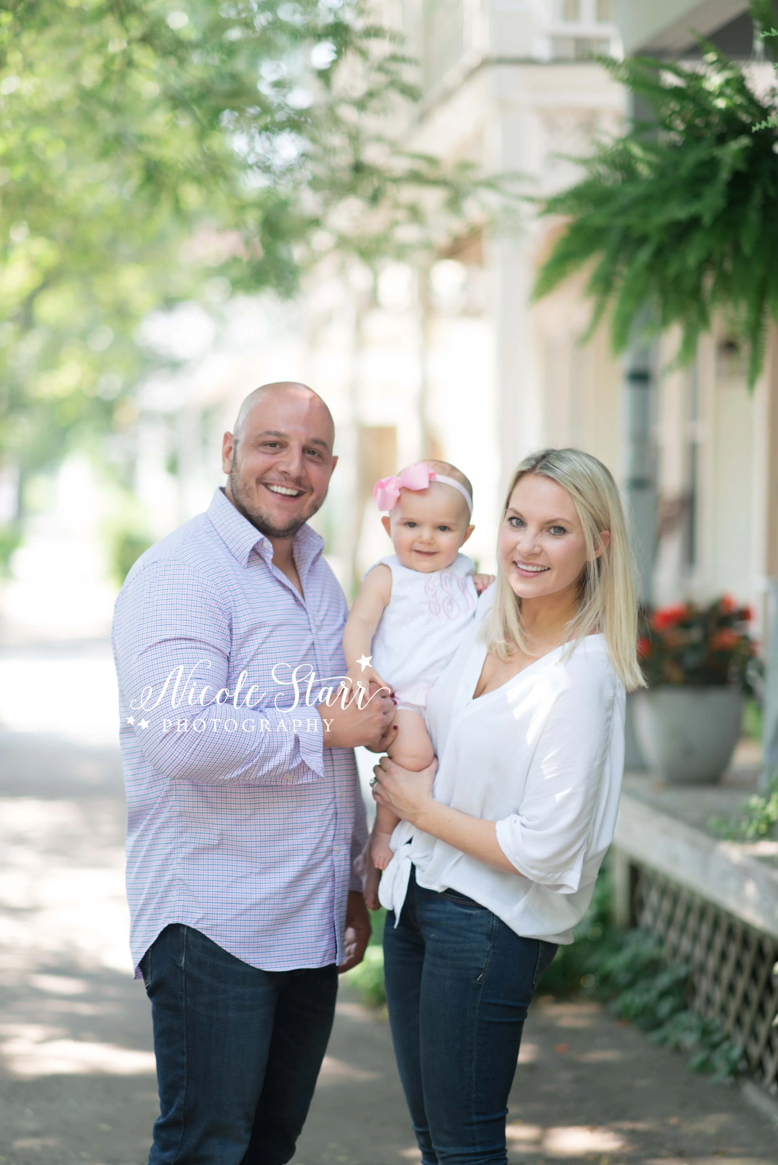 parents pose with toddler during family photos in Saratoga Springs NY with Nicole Starr Photography