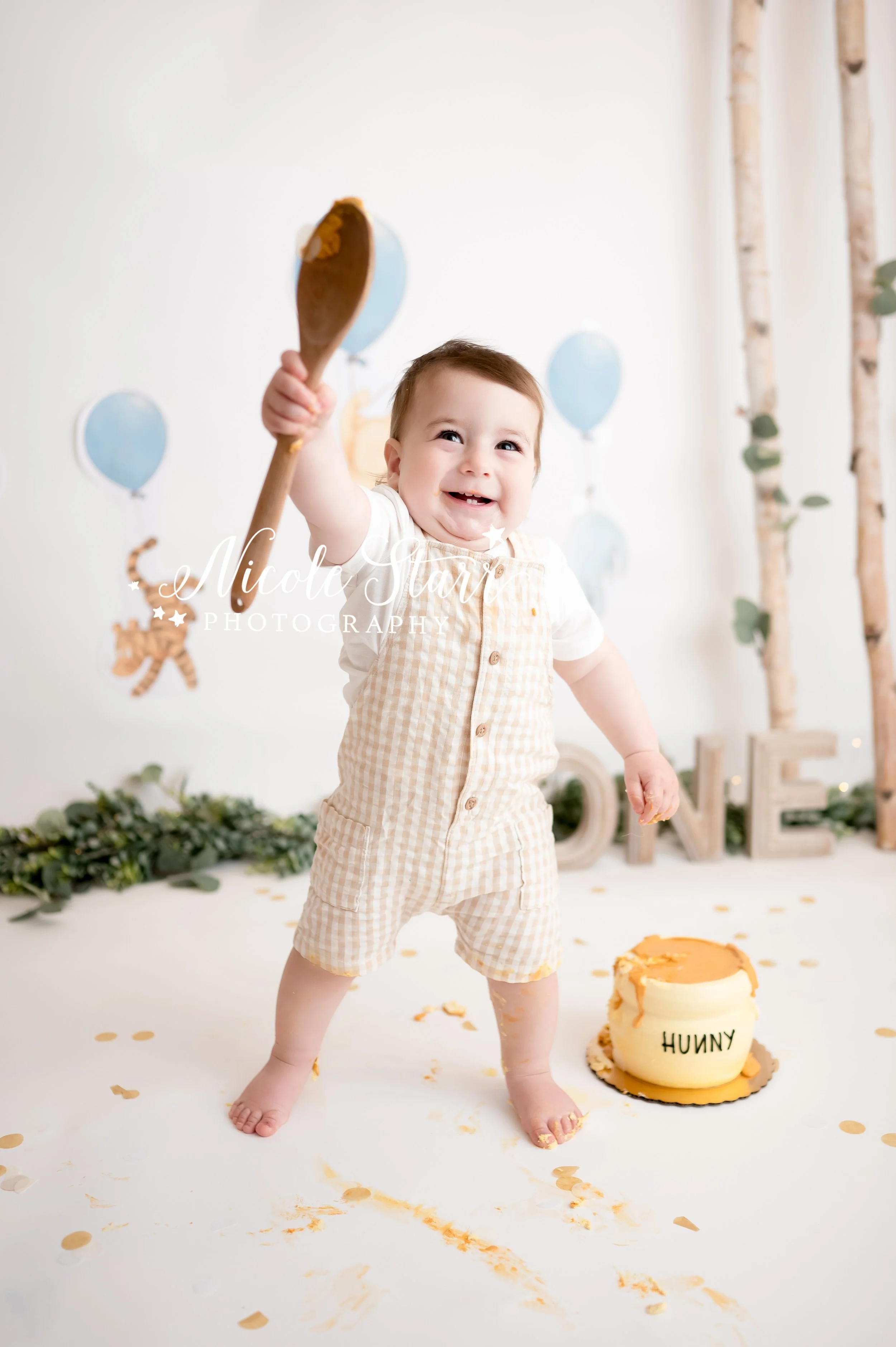 Classic Winnie the Pooh cake smash with Saratoga Springs baby