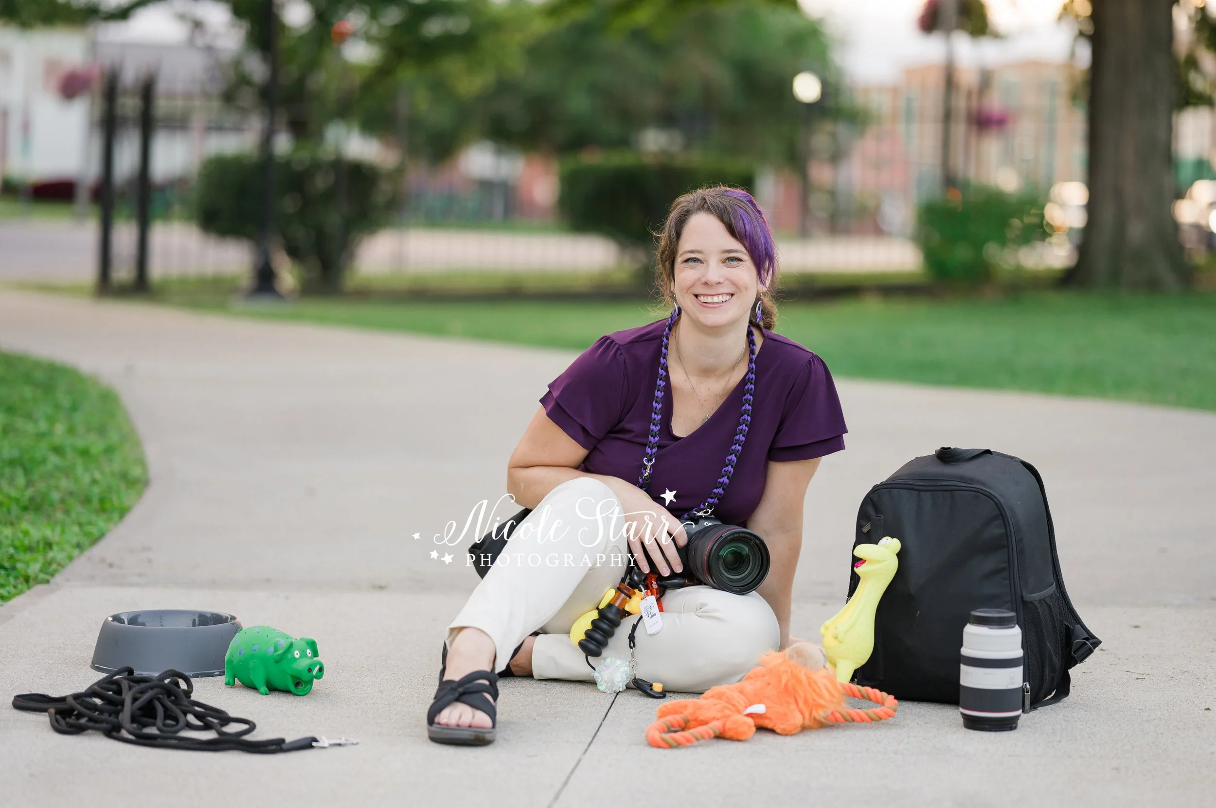 pet photographer sits with camera, dog treats, and dog toys during branding session with Nicole Starr Photography, Saratoga Springs branding photographer
