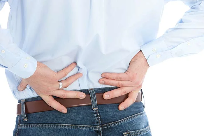 bigstock-Man-Holding-His-Back-While-Suf-84020036.jpg