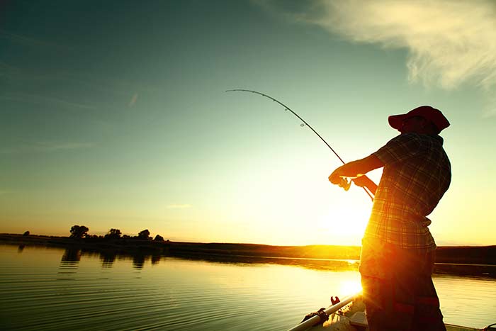 bigstock-Young-man-fishing-on-a-lake-fr-50275337.jpg
