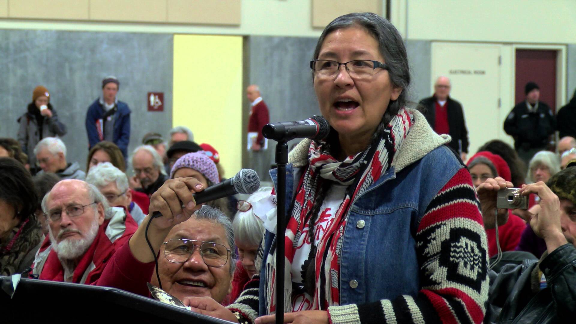 Cathy Sampson-Kruse speaking at the Tesoro-Savage oil terminal public hearing held in Vancouver, WA on January 5th, 2016. (Credit: Michael O’Leary (YouTube screenshot))