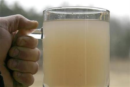 A glass of water taken from a residential well after the start of natural gas drilling in Dimock, Pennsylvania, March 7, 2009. (Credit: Reuters/Tim Shaffer )