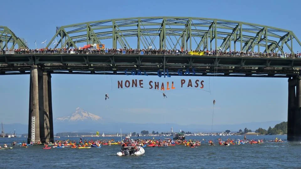 "Coal, Oil, Gas: None Shall Pass" Hundreds of activists blockade Columbia River in protest against fossil fuel shipments (Credit: Portland Rising Tide )