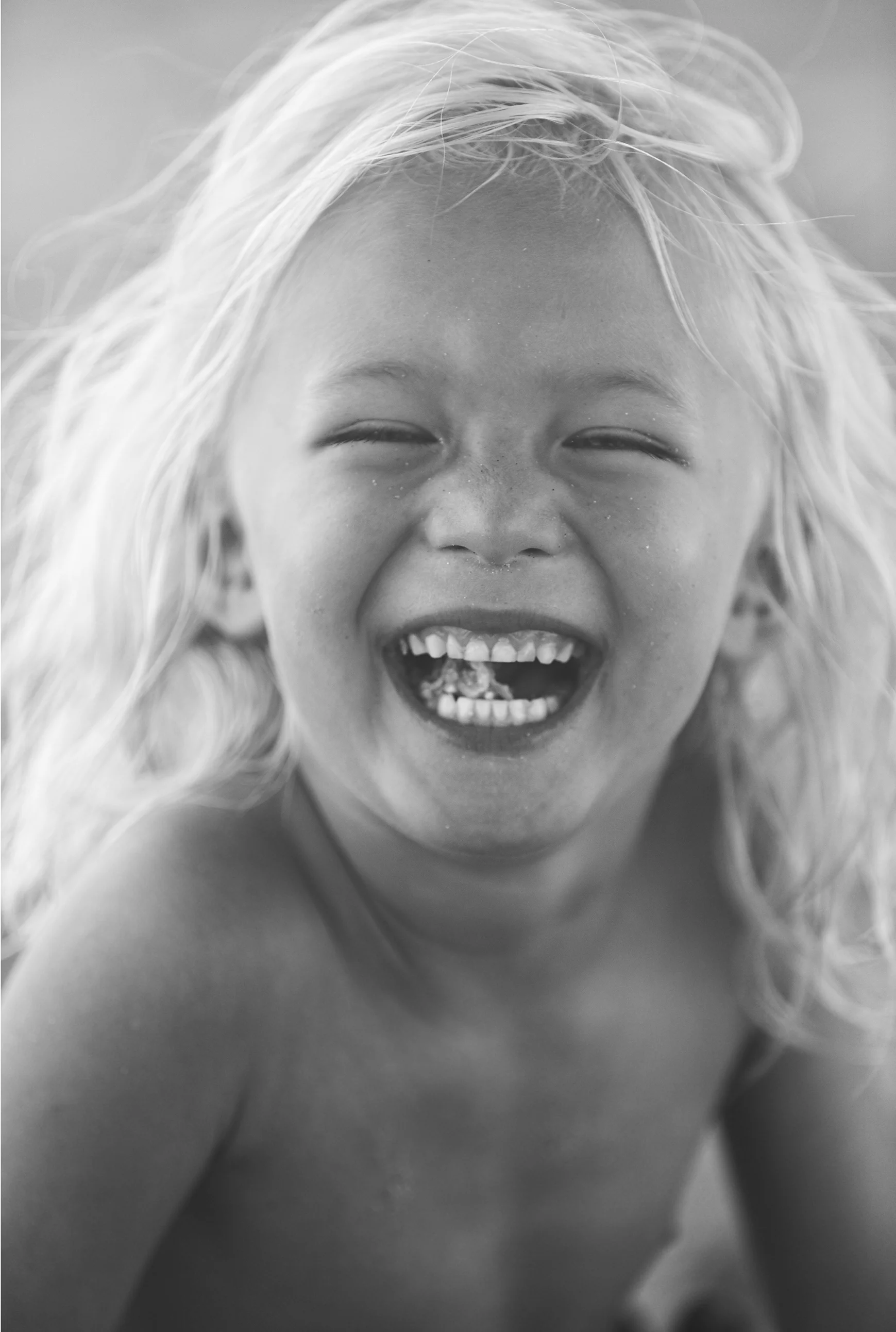 little blonde surfer boy california portrait