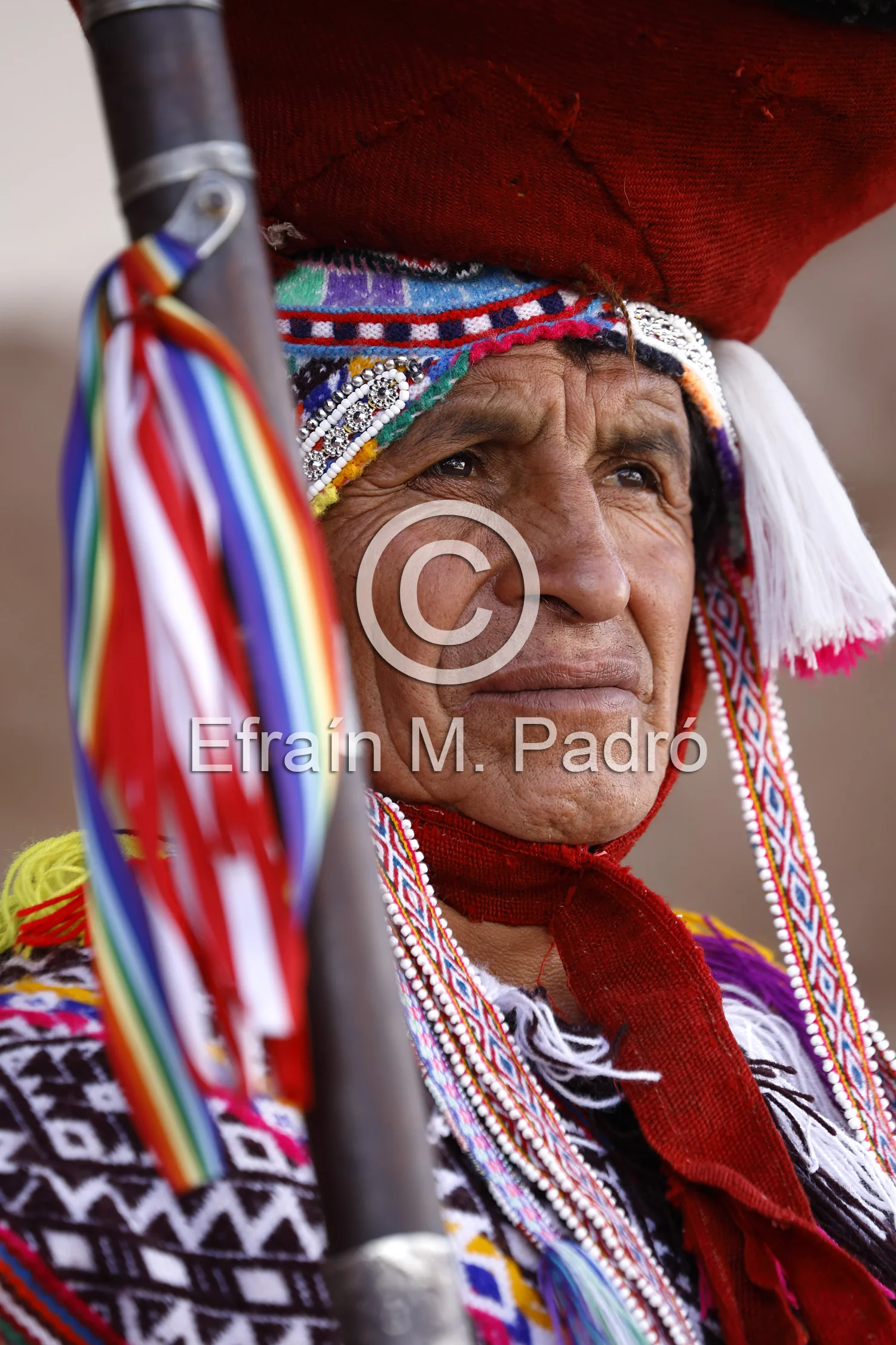 Local Quechua mayor (varayoc) dressed in traditional costume before mass, Pisac Sunday Market, Cusco, Peru