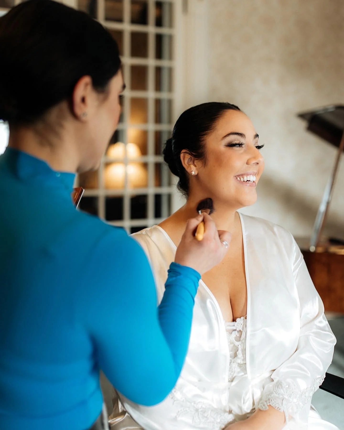 Professional bridal makeup artist creating a wedding-day look