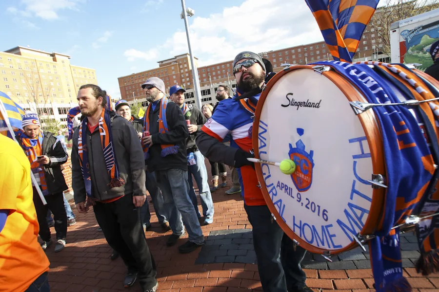 Bjorn Knudsen and his bass drum lead the march into The Bailey at the inaugural home match.