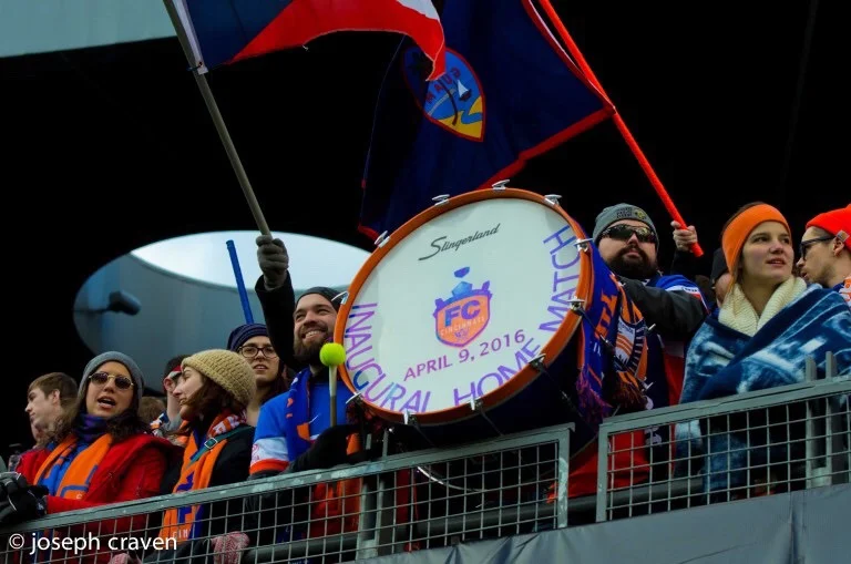 Fox and Bjorn showing off their initial drum for the first home match. Since that April 9th game, they've added a second bass drum and have been joined by several other drummers.