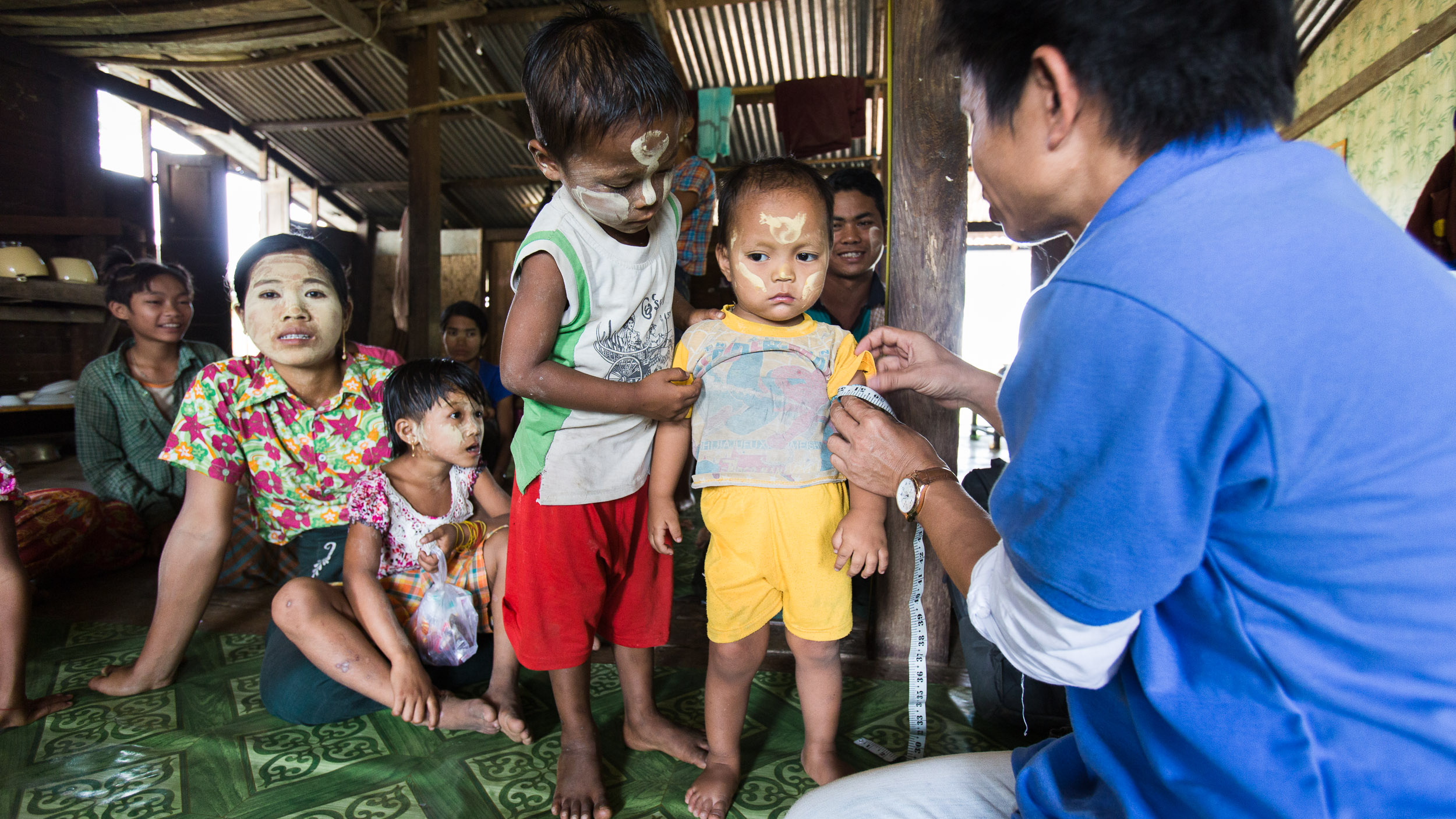 CWS visits with the community in their local monastery and performs the first round of weight, height and arm measurements for the under five children. These kids have never been measured before and record keeping will help track the effects of the nutrition training in the community.