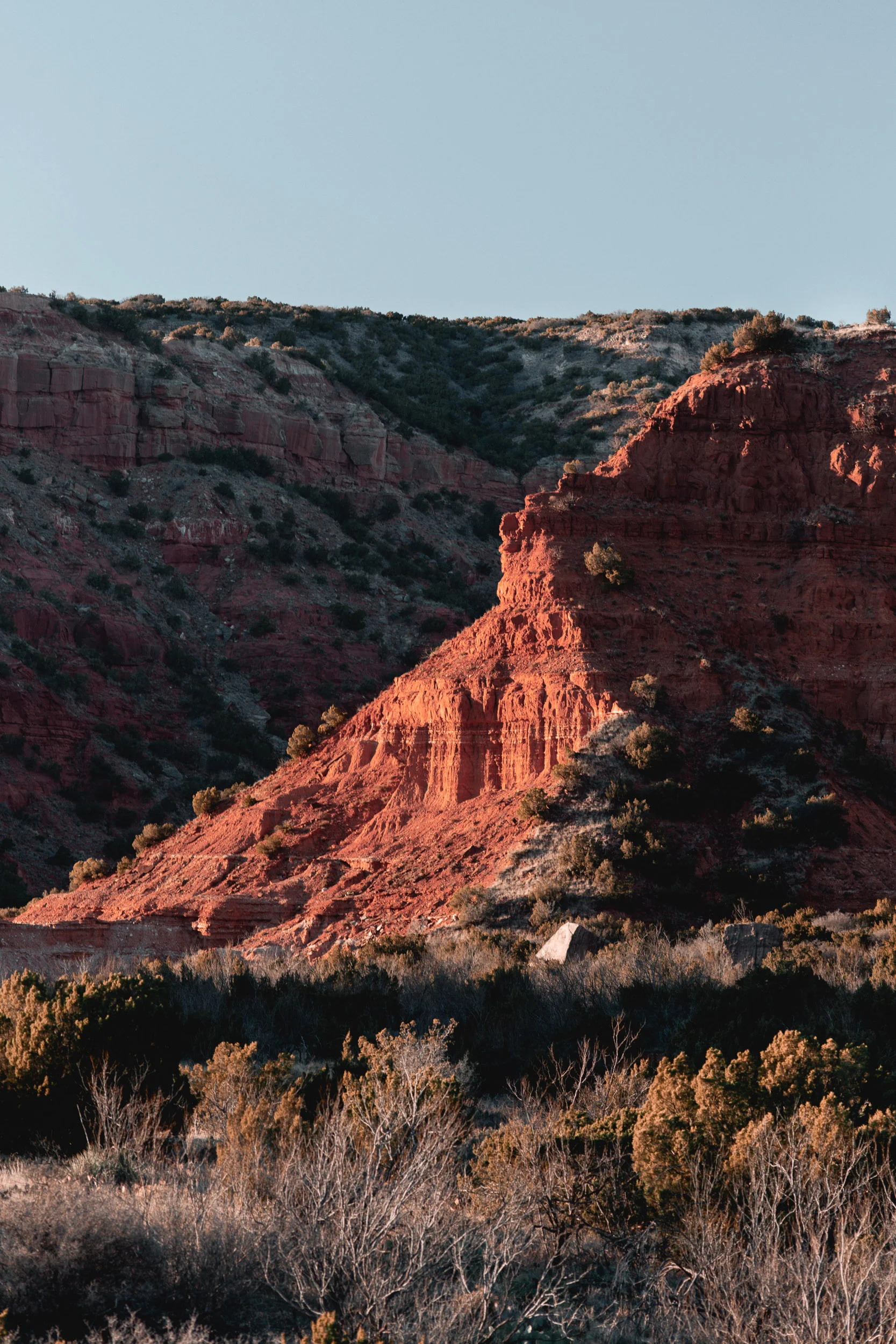 Sandstone and gypsum create the vibrant colors that illuminate orange at sunrise and red at sunset.