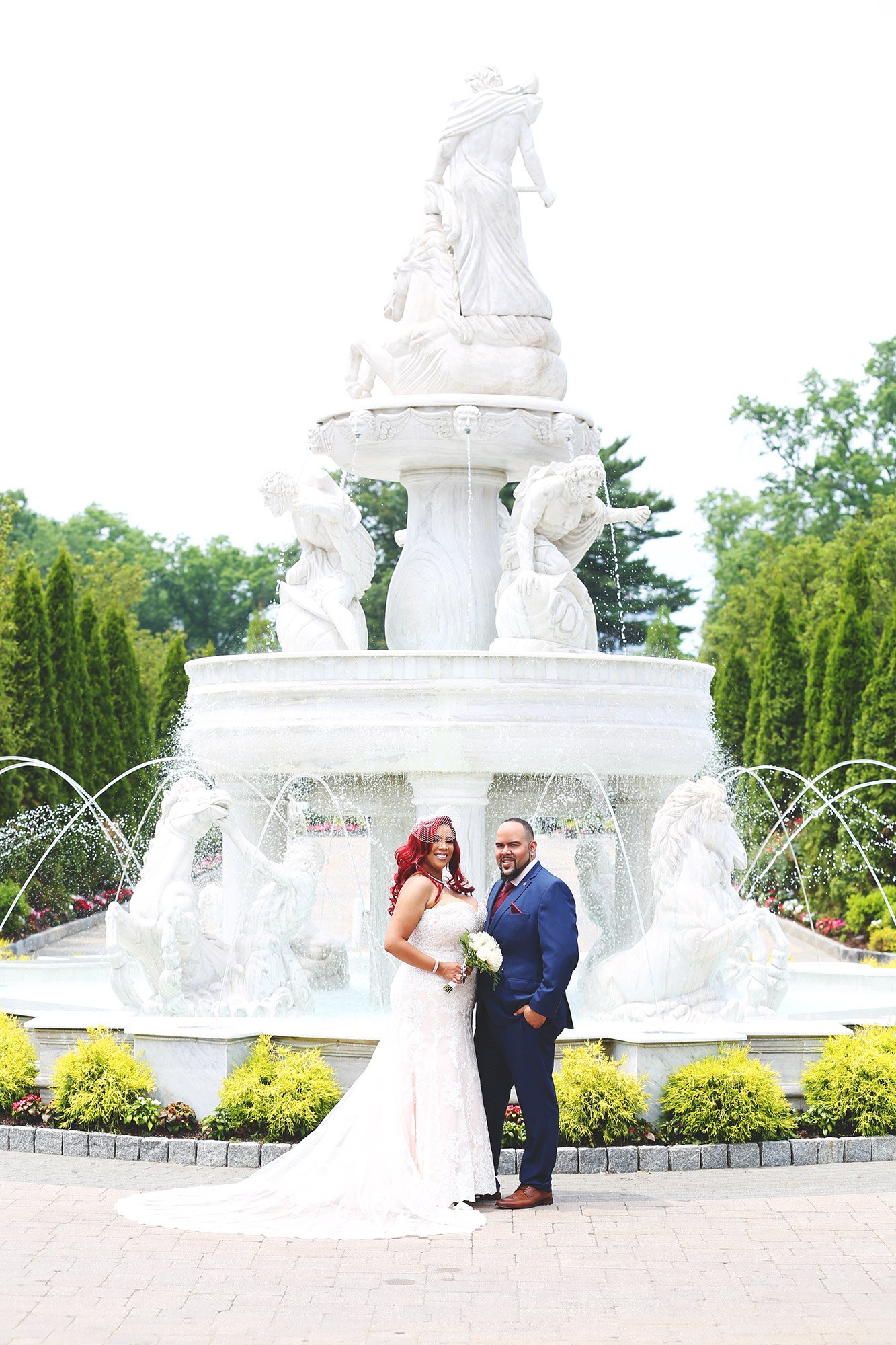 wedding couple photo in front of water fountain at the surf club