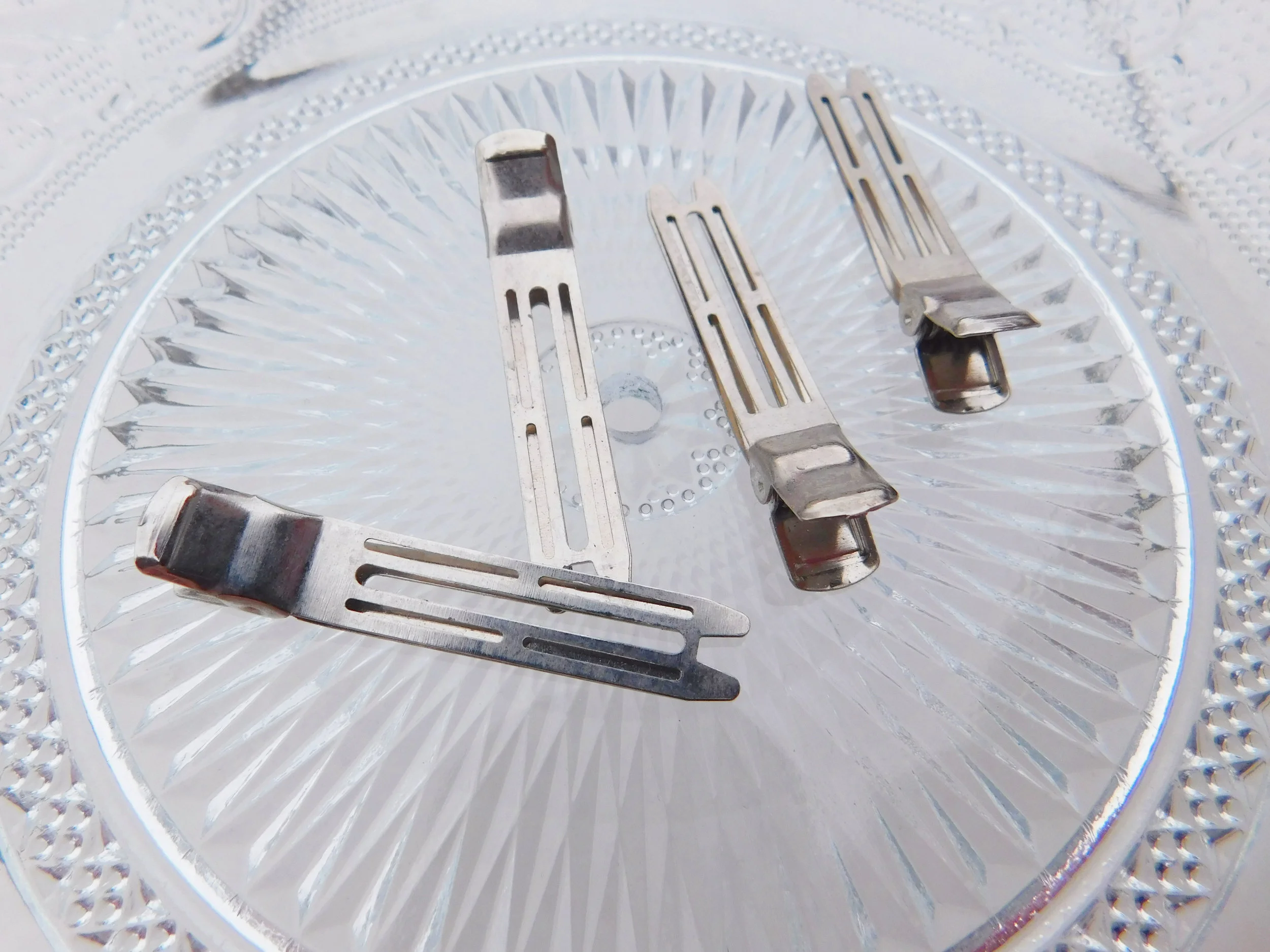 Spring clips, like sectioning clips, are a great way of securing your hair piece in place.