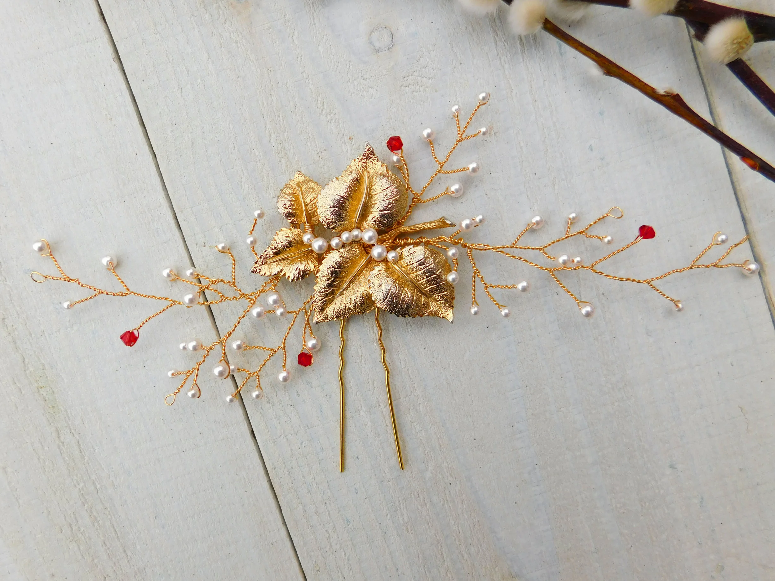 Laura’s hair vine (above and left) featured a vintage brooch and delicate vines of pearls and red Swarovski crystals. The gold hair pin secured the heavier brooch detail in place.