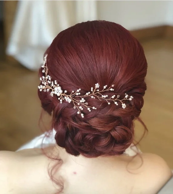 Copper hair vine in red hair.jpeg
