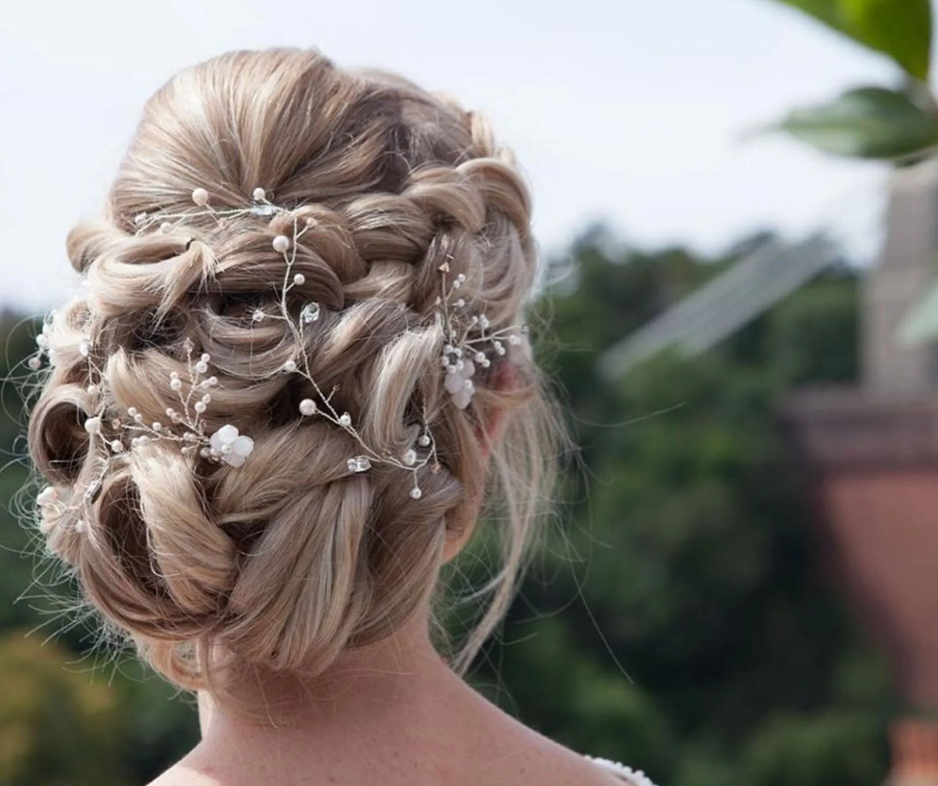 blonde haired bride with hair vine and pins.jpg