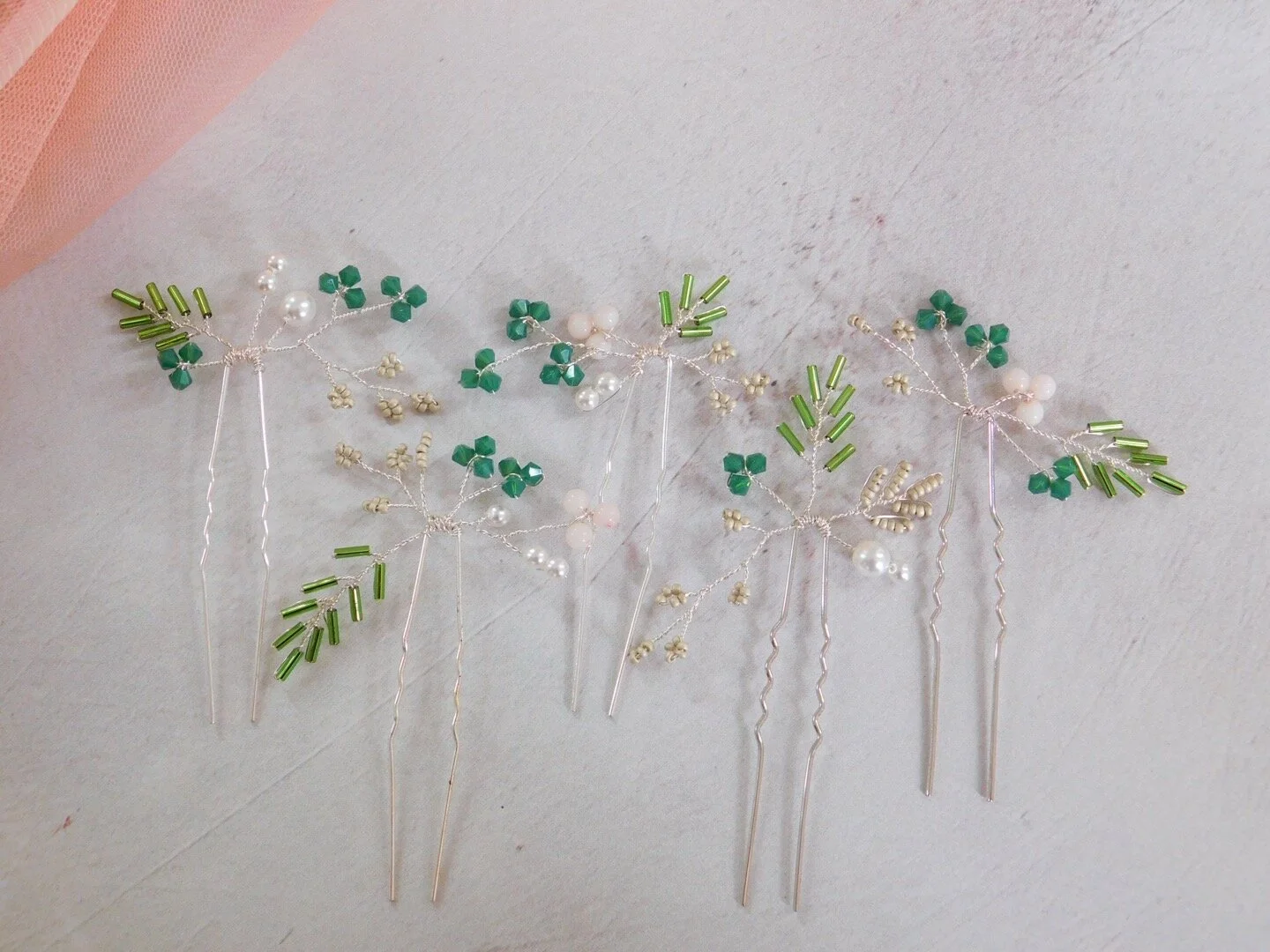 Pale pink and green floral-inspired bridal hair pins
