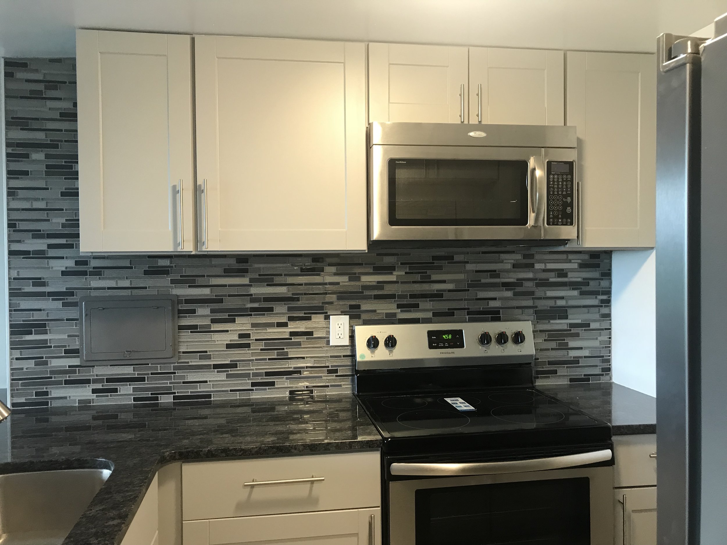 Kitchen in my condo. I love the backsplash!