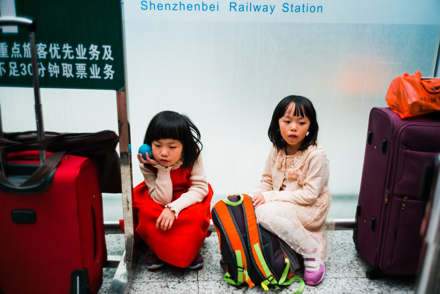 girls waiting at railway station.jpg