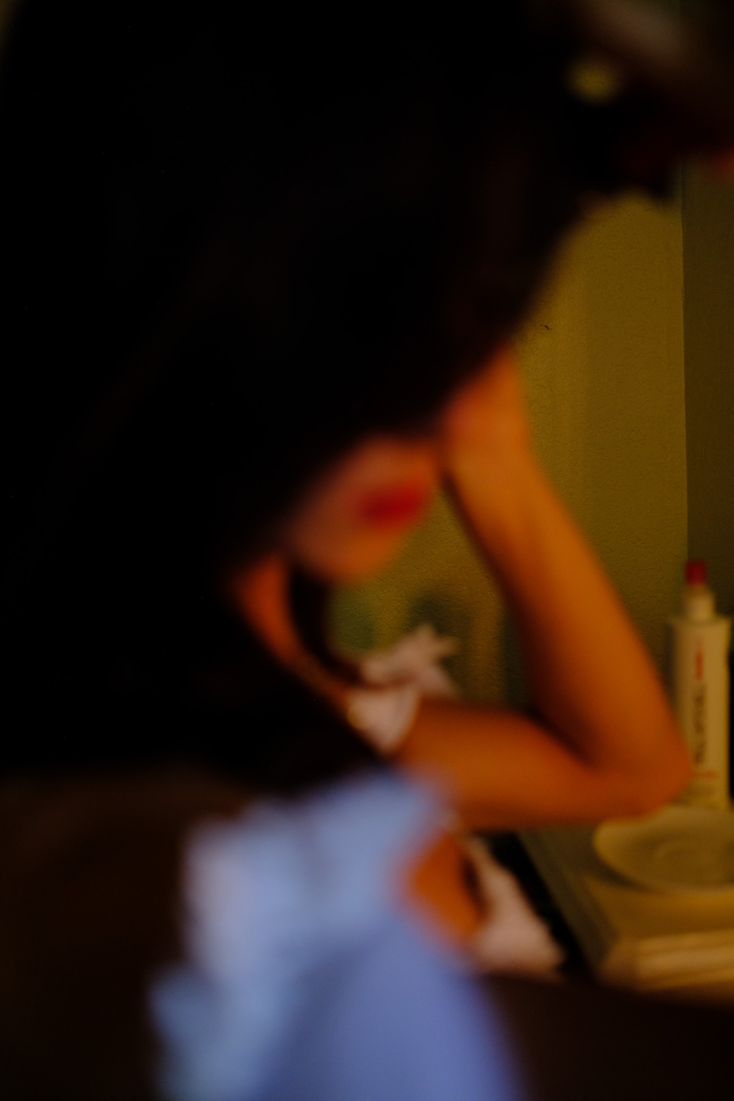 blurry photo of bride curling her hair.jpg