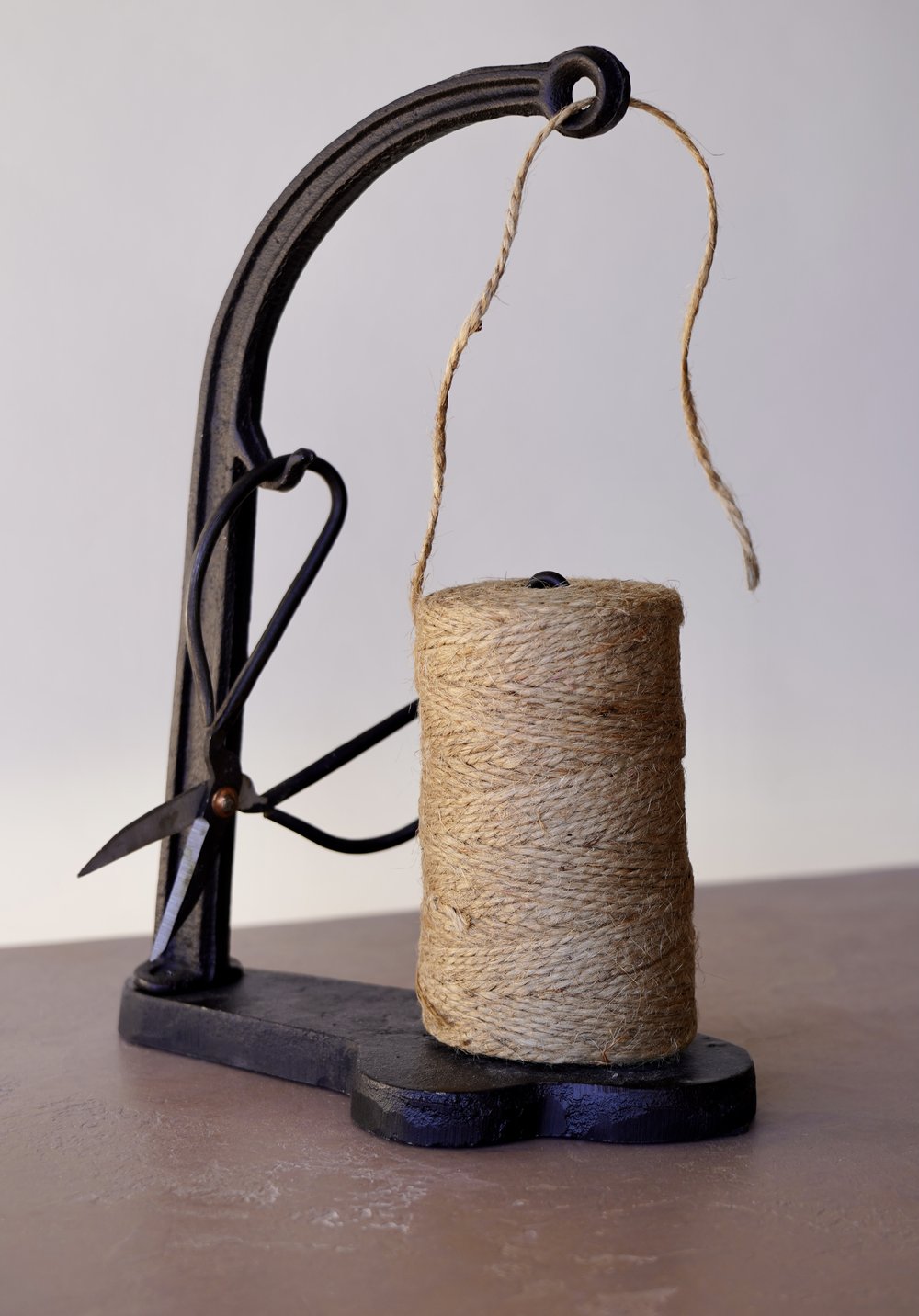 Cast iron string holder, jute rope dispenser