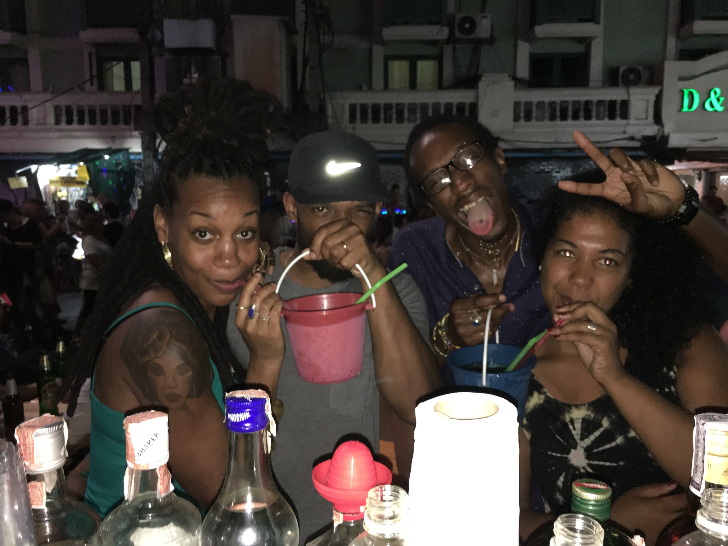 Drinking buckets of alcohol on Khao San Road in Bangkok Thailand with old friends from college. 