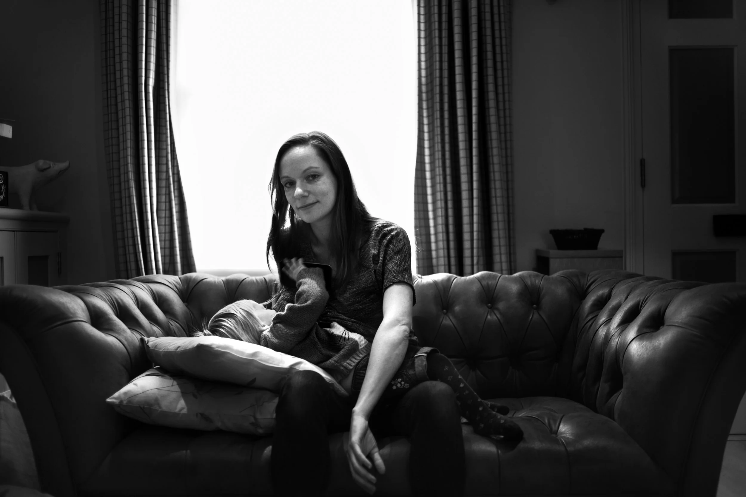 “I don’t particularly enjoy breastfeeding, but it fits with my path of least resistance approach to parenting. Sad baby? Hurt baby? Bored baby? Awake in the middle of the night? Too sick to eat solid food? It’s very easy to offer her some milk and she quickly gets over whatever is bothering her. It wasn’t easy to start with but once we both got the hang of things, I was glad we persevered. It makes life a lot easier. That said, I still don’t like feeding her in public. She’s an extreme wiggler and if she’s not yanking my hair, she’s trying to pull out my teeth or attempting to fit her entire fist in my mouth. Inevitably, I end up flashing more flesh than I intended, but no one ever seems to notice. I hadn’t planned to continue breastfeeding past a year (16 months so far). I always thought the mothers who breastfed toddlers were the ones with a point to prove and that the world would judge me for continuing to stick my nipple inside something with teeth. In reality, no one I’ve met cares one way or another what I do with my baby and my boobs. It seems like a silly thing to have worried about in retrospect. Challenges? To begin with it was sore nipples, let down pain, cluster feeding for hours and hours, and getting over my shyness about the odd public glimpse of boob. Now, it’s remembering to give my baby a toy to play with so she doesn’t stick her fingers up my nose. Other people’s opinions have never been an issue, though. Advice? Just do what works for you. It’s really not a big deal how you feed your baby and there’s already enough to worry about.”