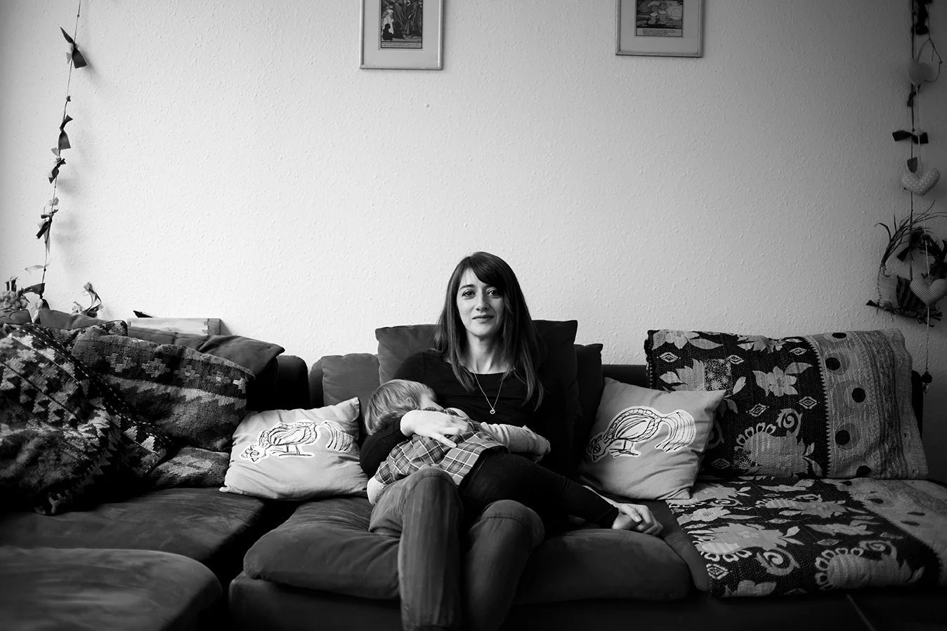 “Breastfeeding has been my odyssey. I always planned on it as it’s a natural language in my family and I consider myself lucky to have such positive role models in my mum and my sister. My mum breastfed me for a year (at a time when it wasn’t the norm in the country) and my sister breastfed both her children until well past toddlerhood, so the thought of bottles and formula was something completely alien to me. Nonetheless, it hasn’t come easy. My daughter had jaundice and tongue tie and was drastically underweight for the first five months of her life which meant I had to fight tooth and nail to continue breastfeeding. I find looking back of photos of her at that time very upsetting still. I saw countless midwives, lactation consultants and paediatricians. I even took my daughter to Spain, by myself, at four months, broken and heartbroken at the prospect of losing the connection we had, to see a wonderful lady who taught me the importance of passion and good positioning in breastfeeding. “Baby needs to be encrusted into your breast”, is her mantra. I feel like support is very mixed in this country. In some areas there is great lactation support and in some not so much. My main criticism of the health service is that when breastfeeding problems are experienced not many health care professionals ask why, they just try to fill the hole with formula. I’m not against using formula when absolutely necessary, in the end it helped us to continue feeding, but it wouldn’t even exist if midwives, doctors and families, were properly trained to support mothers in the very early days. I’m so glad that I persevered, despite the adverse pressure to give up, as boob time is so much more than milk to her and me. My partner has always been very supportive in that aspect and I’m lucky that he is. I enjoy being a proud breastfeeding mum because of everything we went though and have no qualms about feeding in public. I wish more people did so that others wouldn’t feel scared to because it is the most natural thing in the world. My primary goal was to get to a year. My daughter is now 15 months so we might as well keep going for as long as it’s mutually beneficial. I feel like I fought too hard to just give up now that it’s become relatively easy. My advice to a new mum or mum-to-be would be to really check your positioning (don’t just rely on NHS guidance), look out for tongue-tie, and relax! Stress is a milk killer. Support from your partner and family is crucial though, because when the going gets tough (and it will at some point), if everyone is telling to give up, you probably will.”