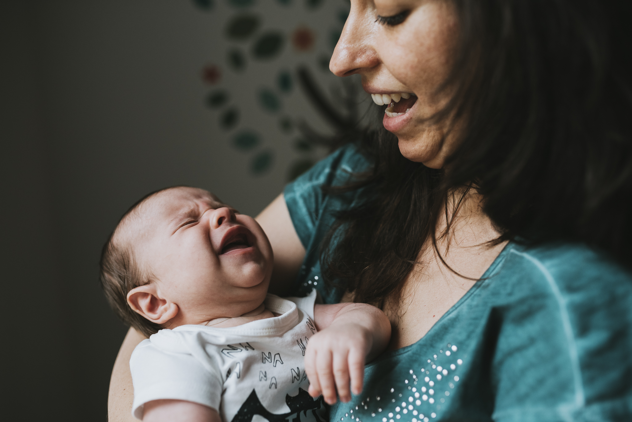 Newborn baby smiling with mom.jpg