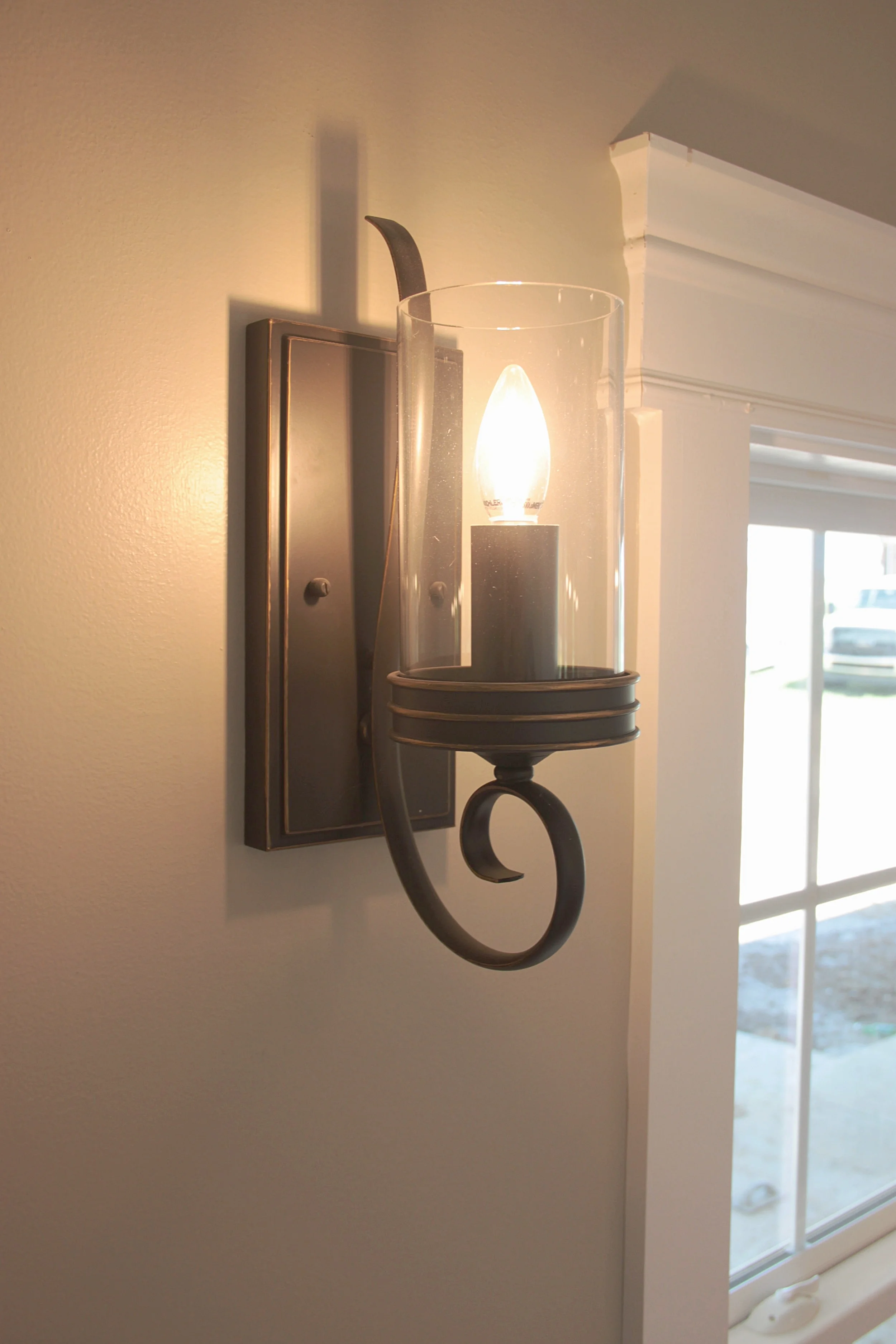 Sconce lighting above the breakfast nook in the kitchen.