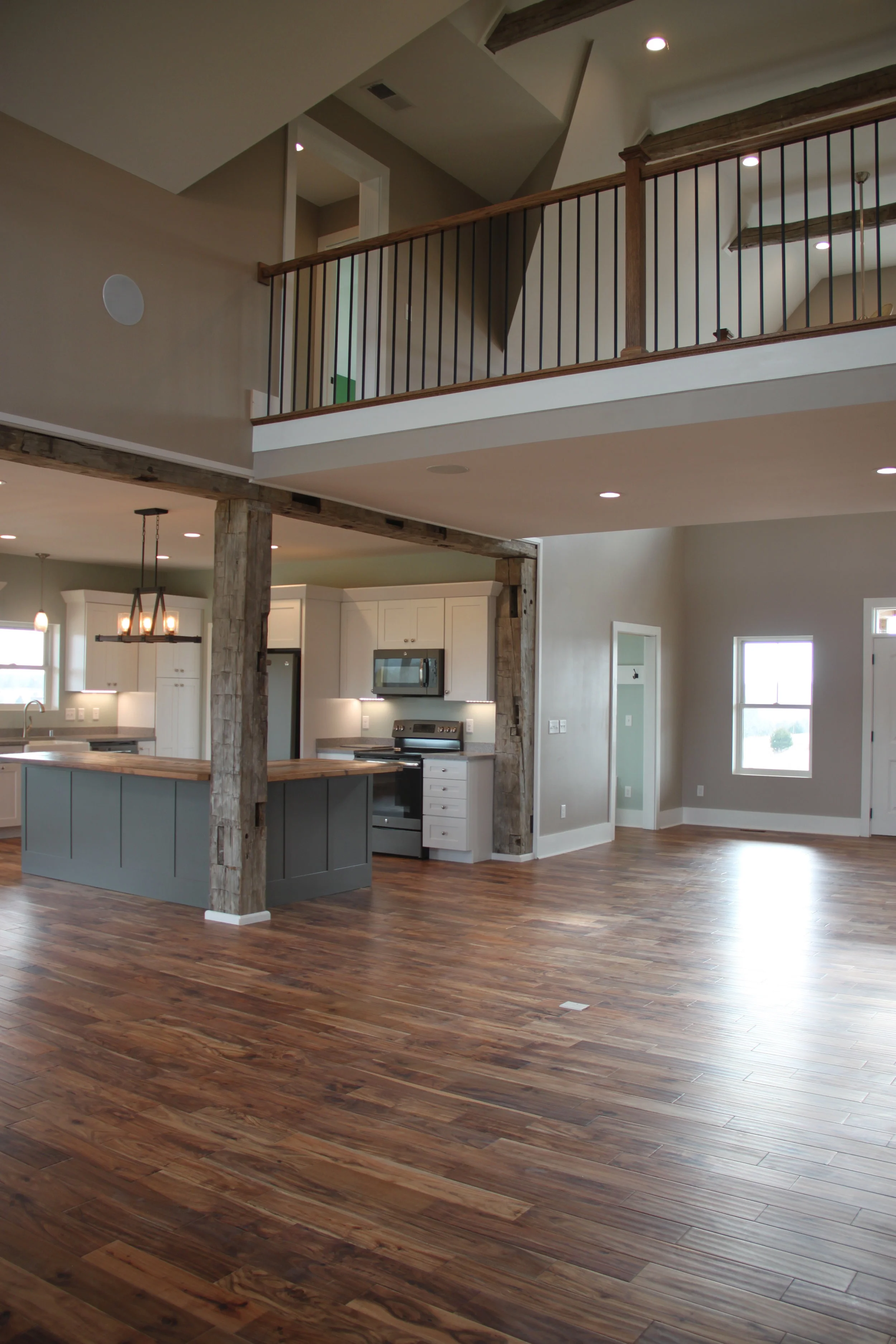 The Sadieville Lodge has vaulted ceilings with exposed beams....and a bridge on the 2nd story to access the bedrooms.