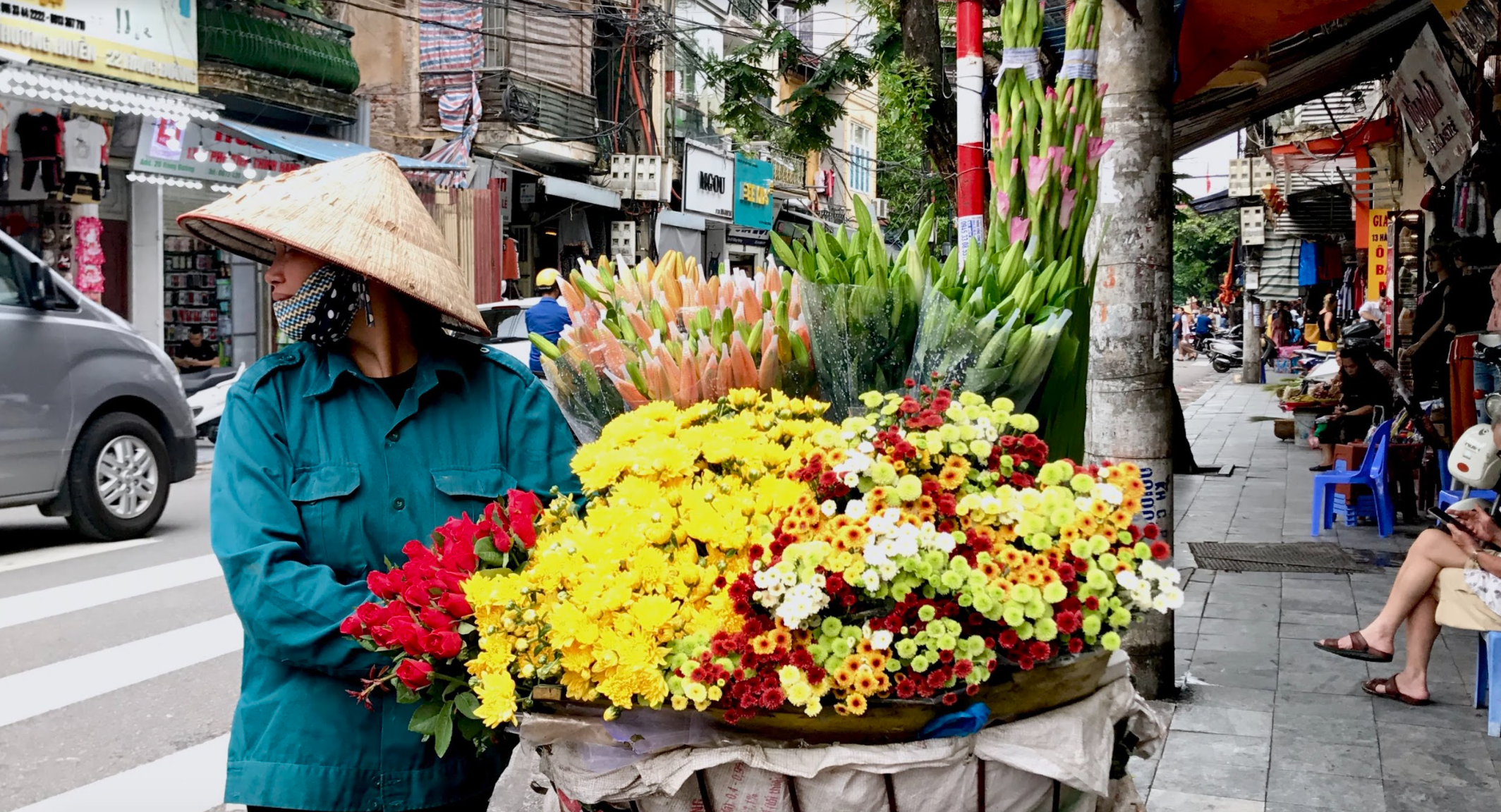 A simple picture of the beauty found in Vietnam. I took this picture in Old Quarters - a rather touristy part of the city, but a place full of culture, fun, and street vendors like this. Aren't the flowers pretty? They smelled just as sweet! 