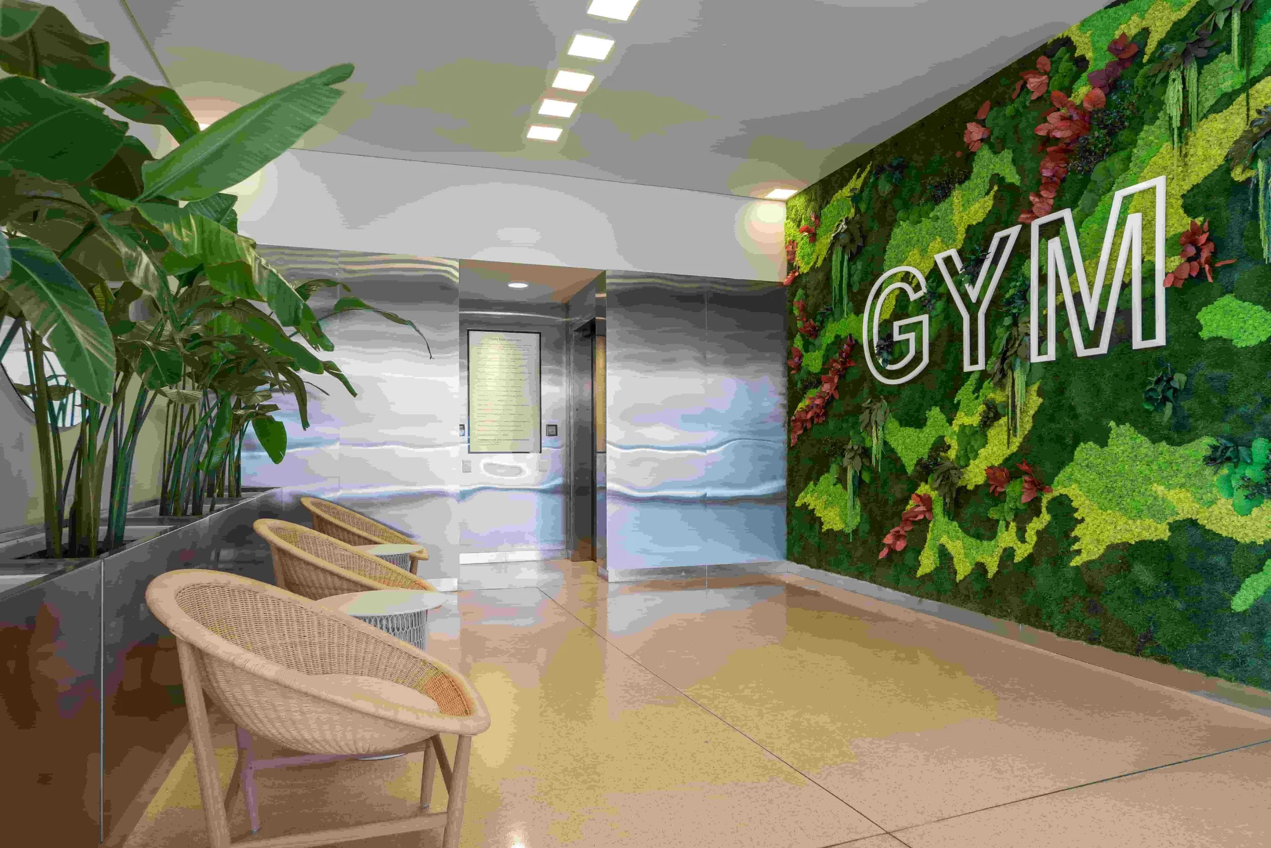 entrance area to gym with green wall, designed by Biofit for Carnegie Mellon University Qatar
