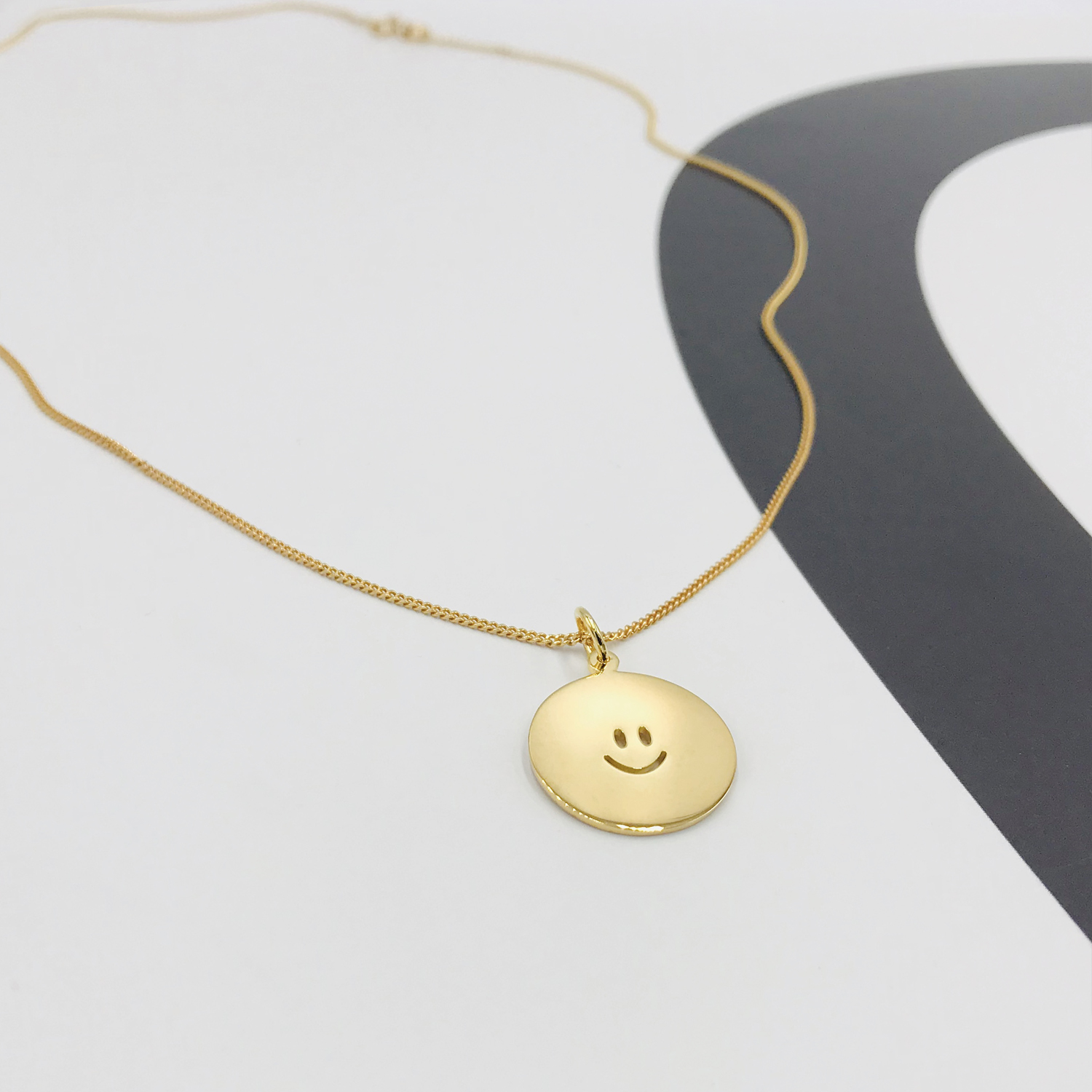 Face Happy large gold.jpg