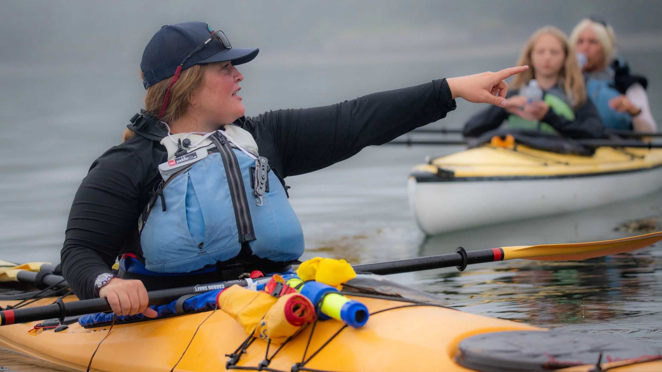 Aubrey identifying wildlife while guiding a tour