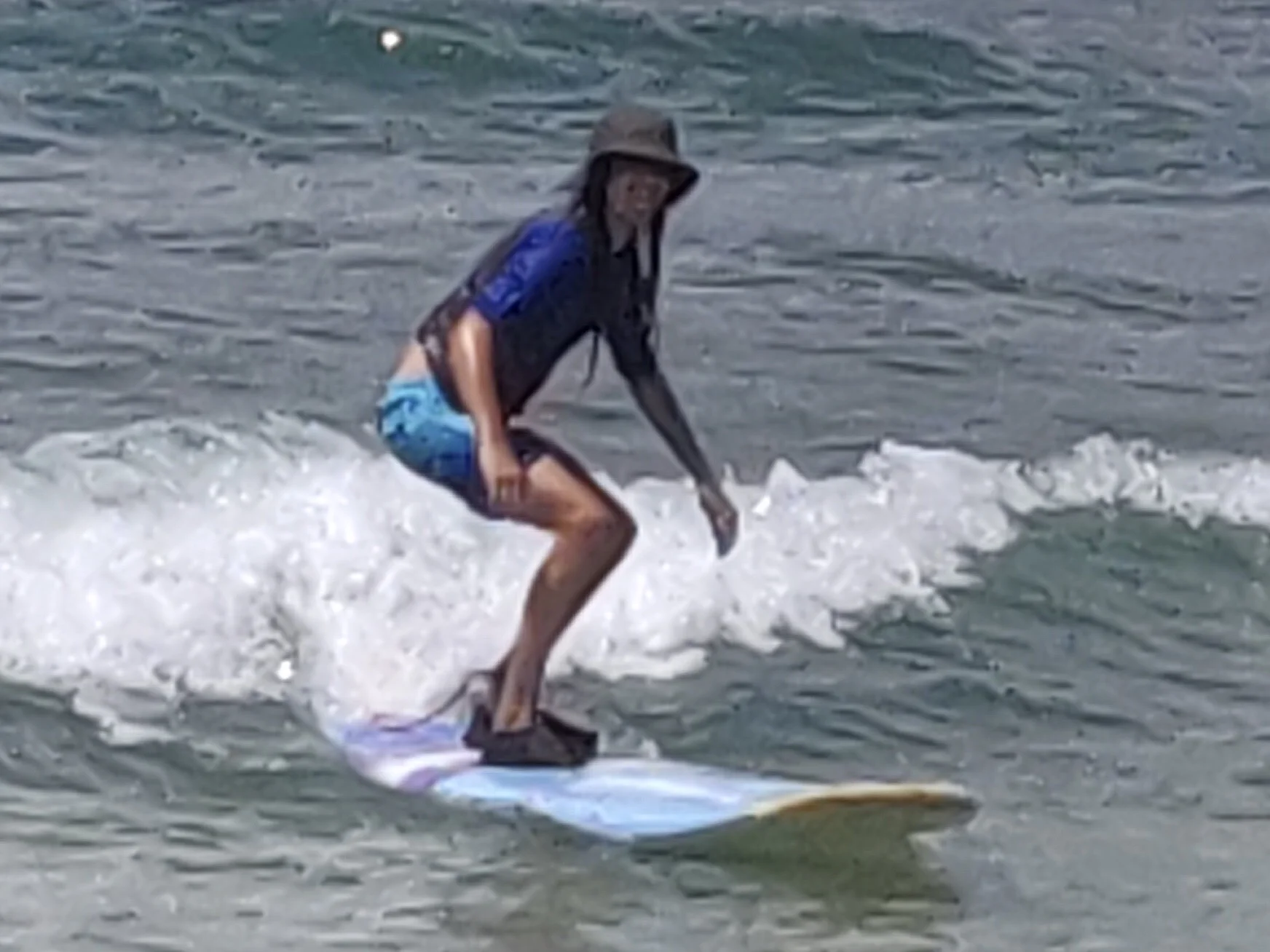 Gabriel surfing in Hawaii