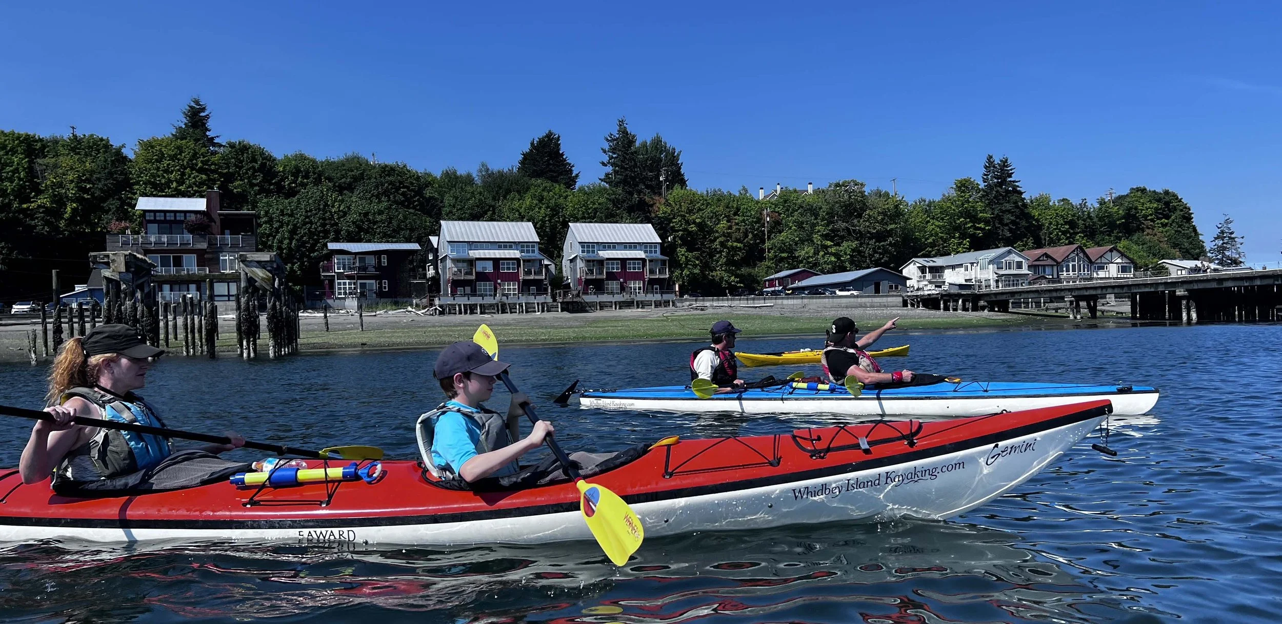 Family kayak tour with children on calm water near Langley, Whidbey Island