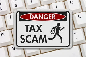 78548162 - tax scam danger sign, a black and white danger sign with text tax scam and theft icon on a keyboard