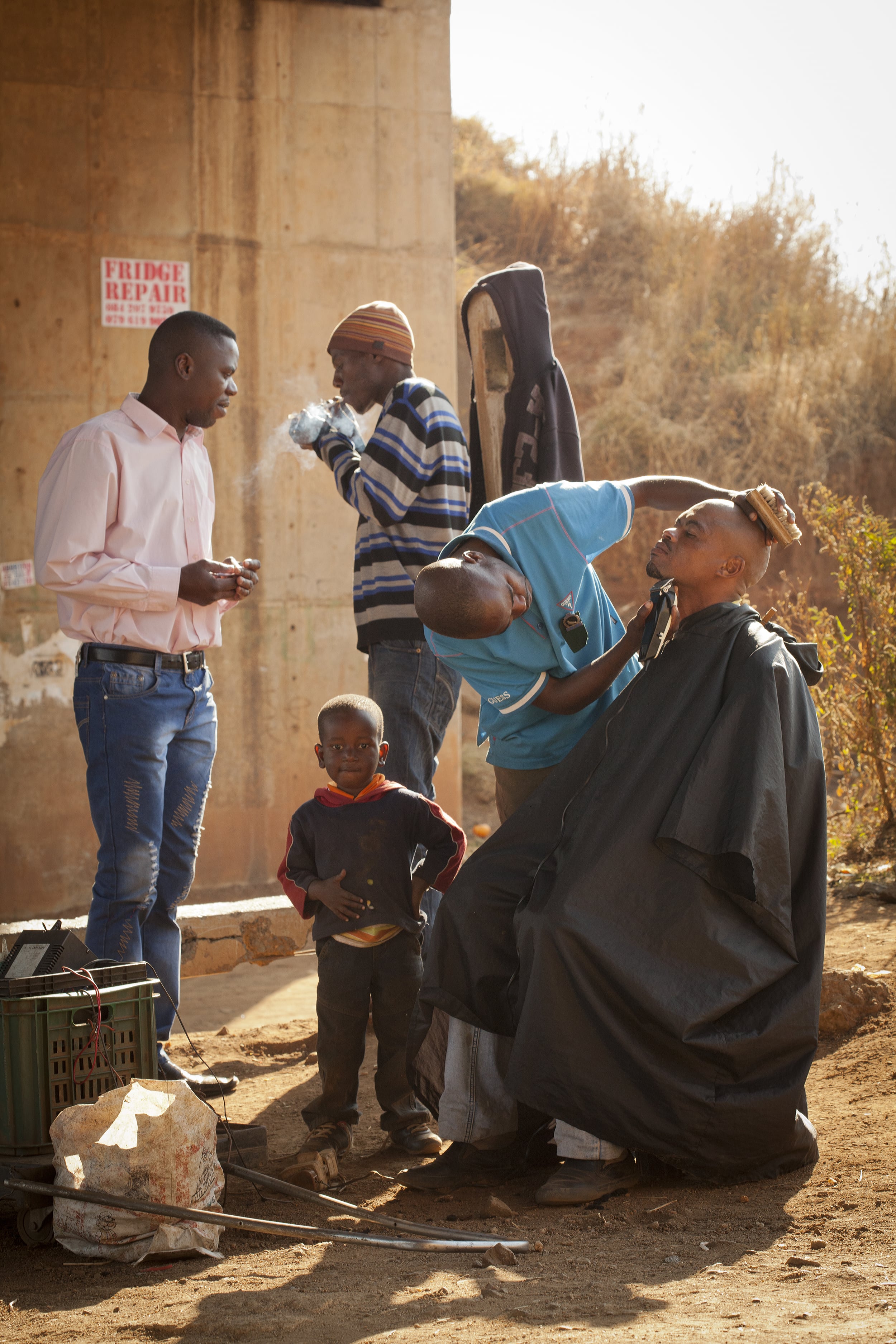 Outdoor barbershop, Kliptown, South Africa.